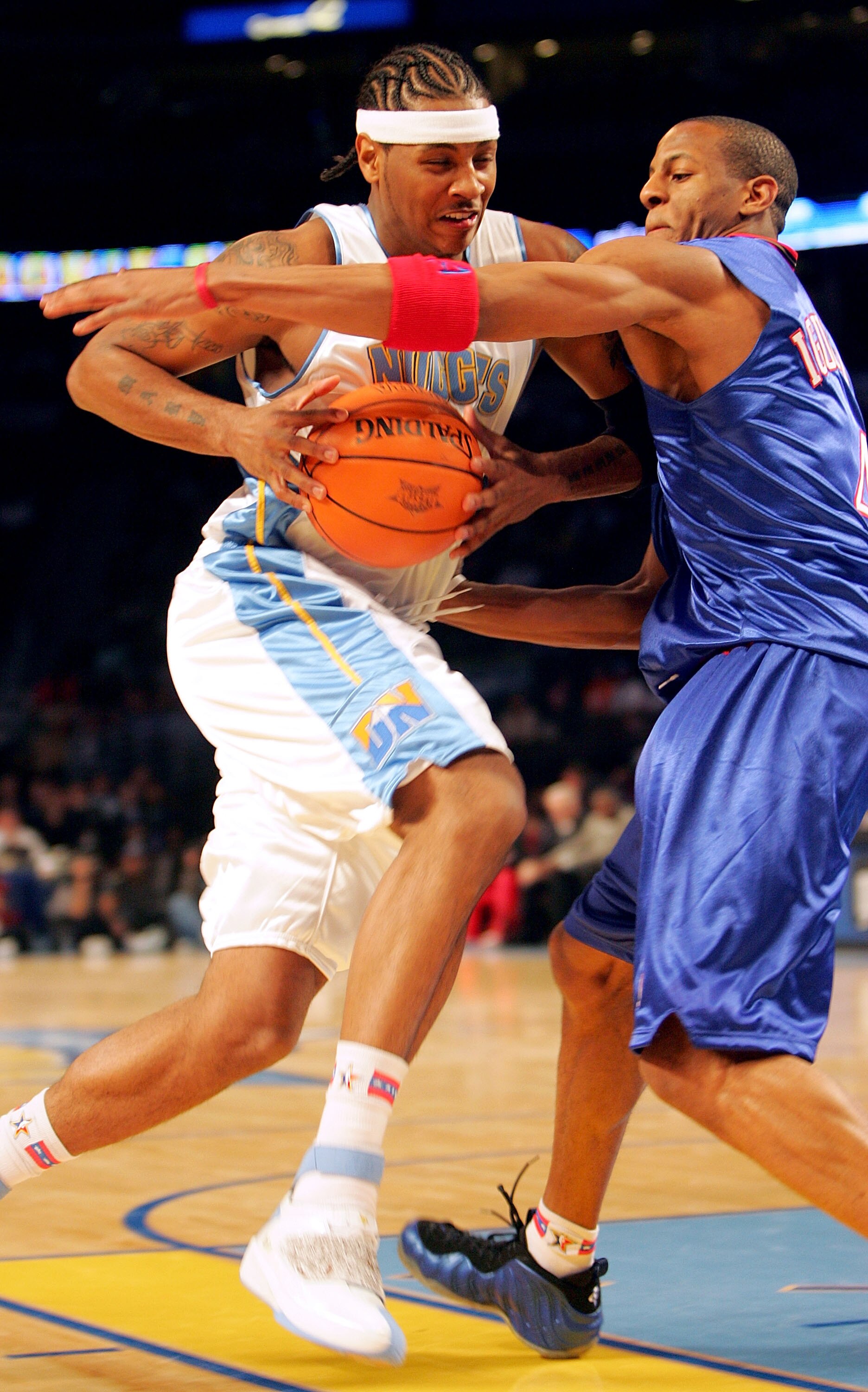 DENVER - FEBRUARY 18:  Carmelo Anthony #15 of the Sophomore Team goes up against Andre Iguodala #4 of the Rookie Team during the got milk? Rookie Challenge, part of 2005 NBA All-Star Weekend at Pepsi Center on February 18, 2005 in Denver, Colorado.  NOTE