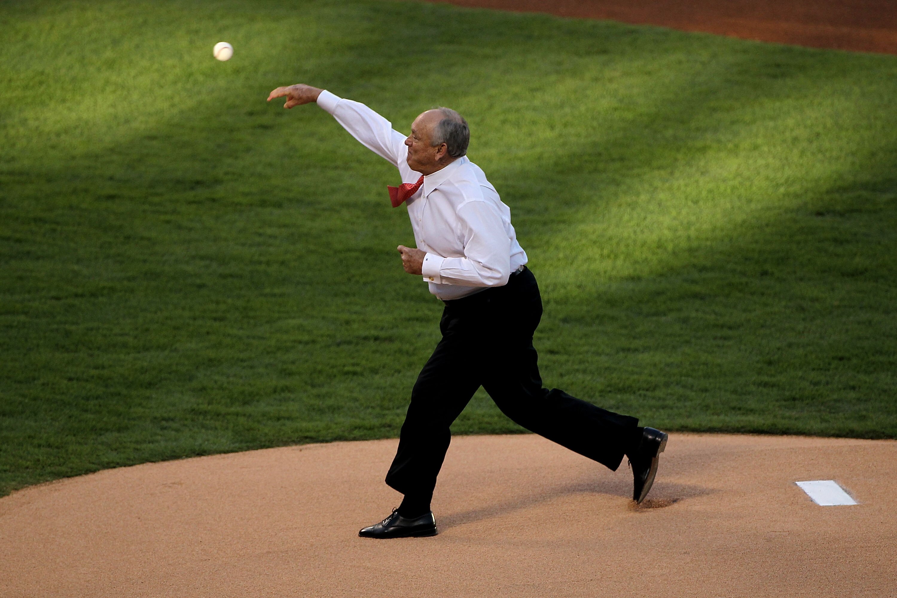 ARLINGTON, TX - OCTOBER 30:  Team President Nolan Ryan of the Texas Rangers throws out the ceremonial first pitch against the San Francisco Giants in Game Three of the 2010 MLB World Series at Rangers Ballpark in Arlington on October 30, 2010 in Arlington