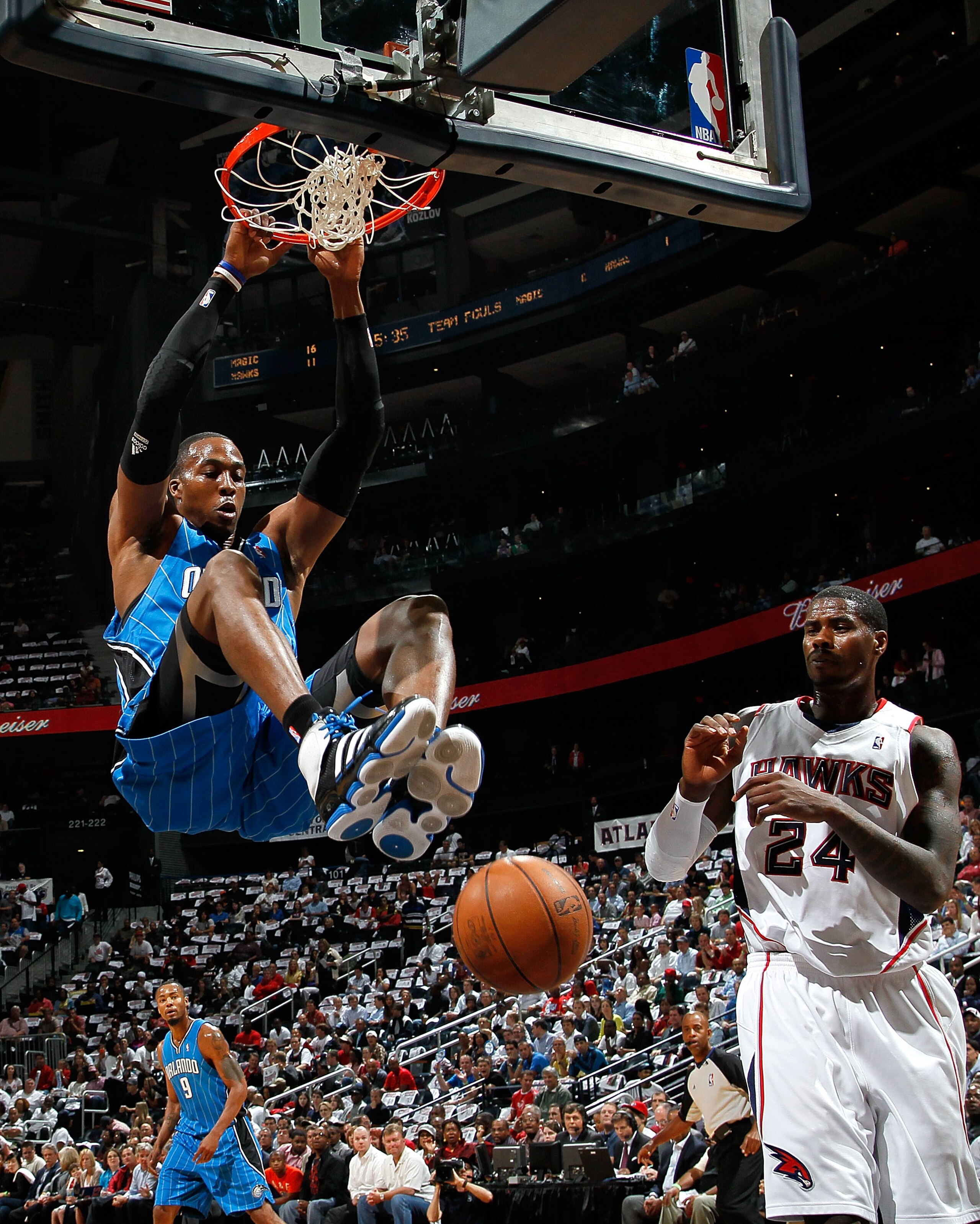ATLANTA - MAY 10:  Dwight Howard #12 of the Orlando Magic dunks against Marvin Williams #24 of the Atlanta Hawks during Game Four of the Eastern Conference Semifinals of the 2010 NBA Playoffs at Philips Arena on May 10, 2010 in Atlanta, Georgia.  NOTE TO