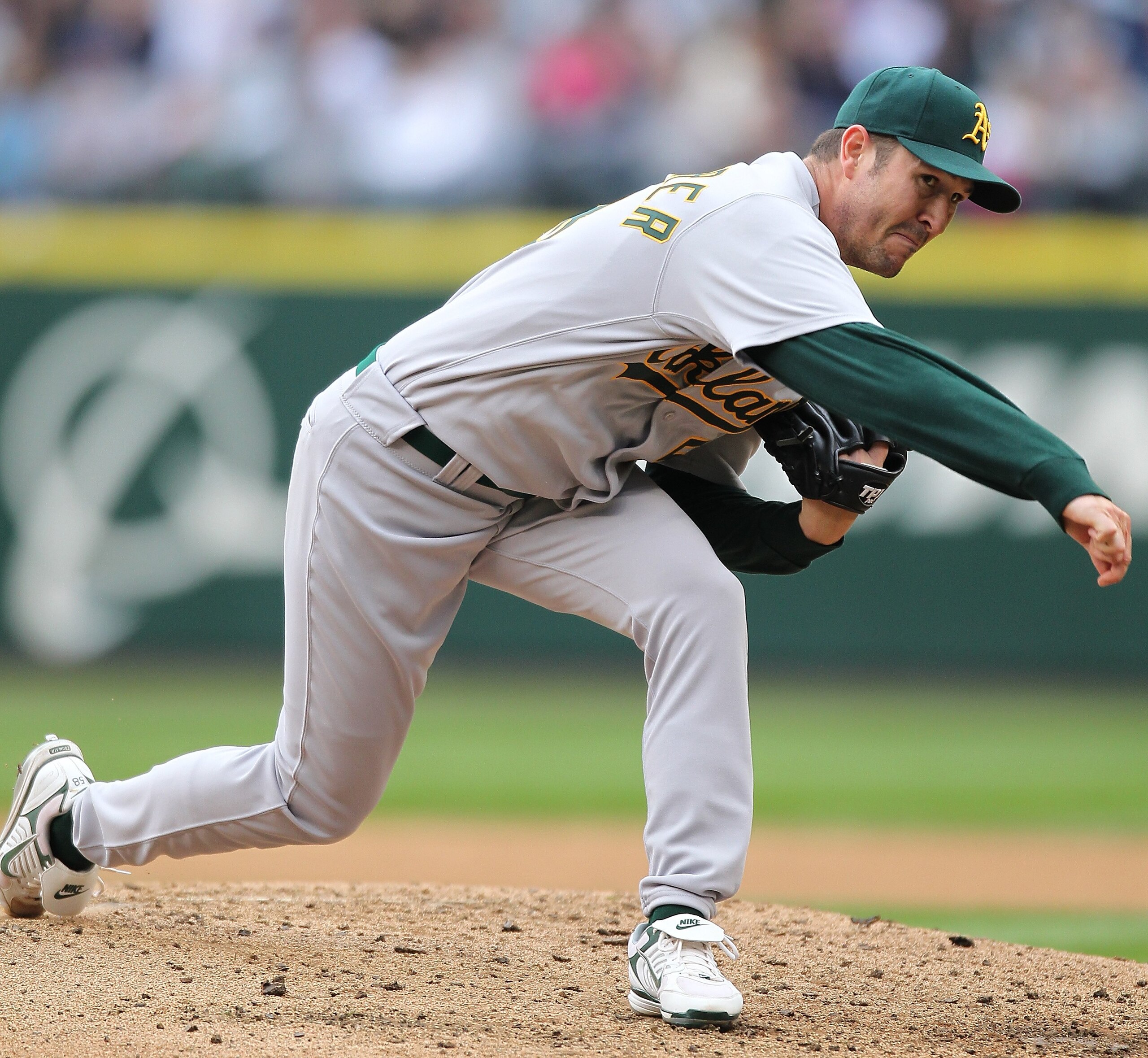 SEATTLE - APRIL 12:  Starting pitcher Justin Duchscherer #58 of the the Oakland Athletics pitches against the Seattle Mariners during the Mariners' home opener at Safeco Field on April 12, 2010 in Seattle, Washington. (Photo by Otto Greule Jr/Getty Images