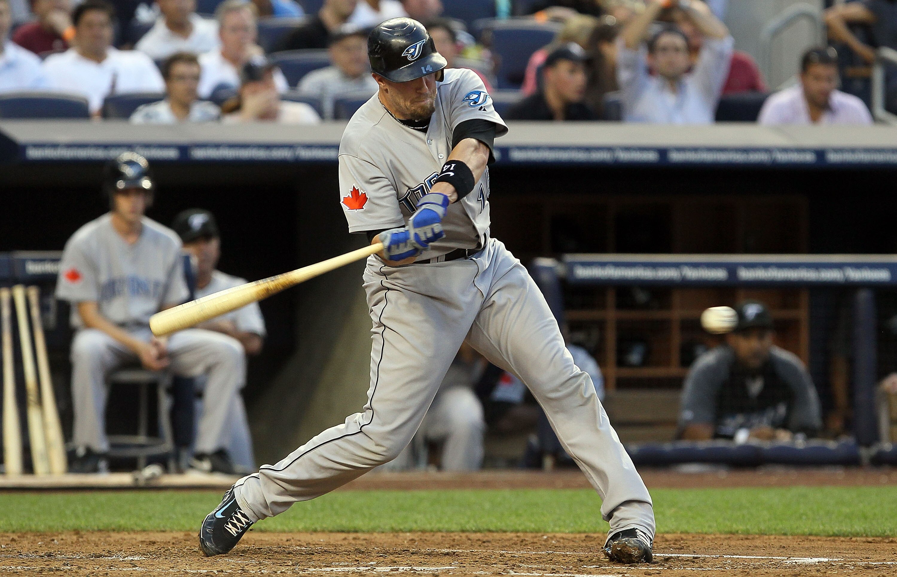 NEW YORK - AUGUST 03:  John Buck #14 of the Toronto Blue Jays connects on a second inning RBI single against the New York Yankees on August 3, 2010 at Yankee Stadium in the Bronx borough of New York City.  (Photo by Jim McIsaac/Getty Images)