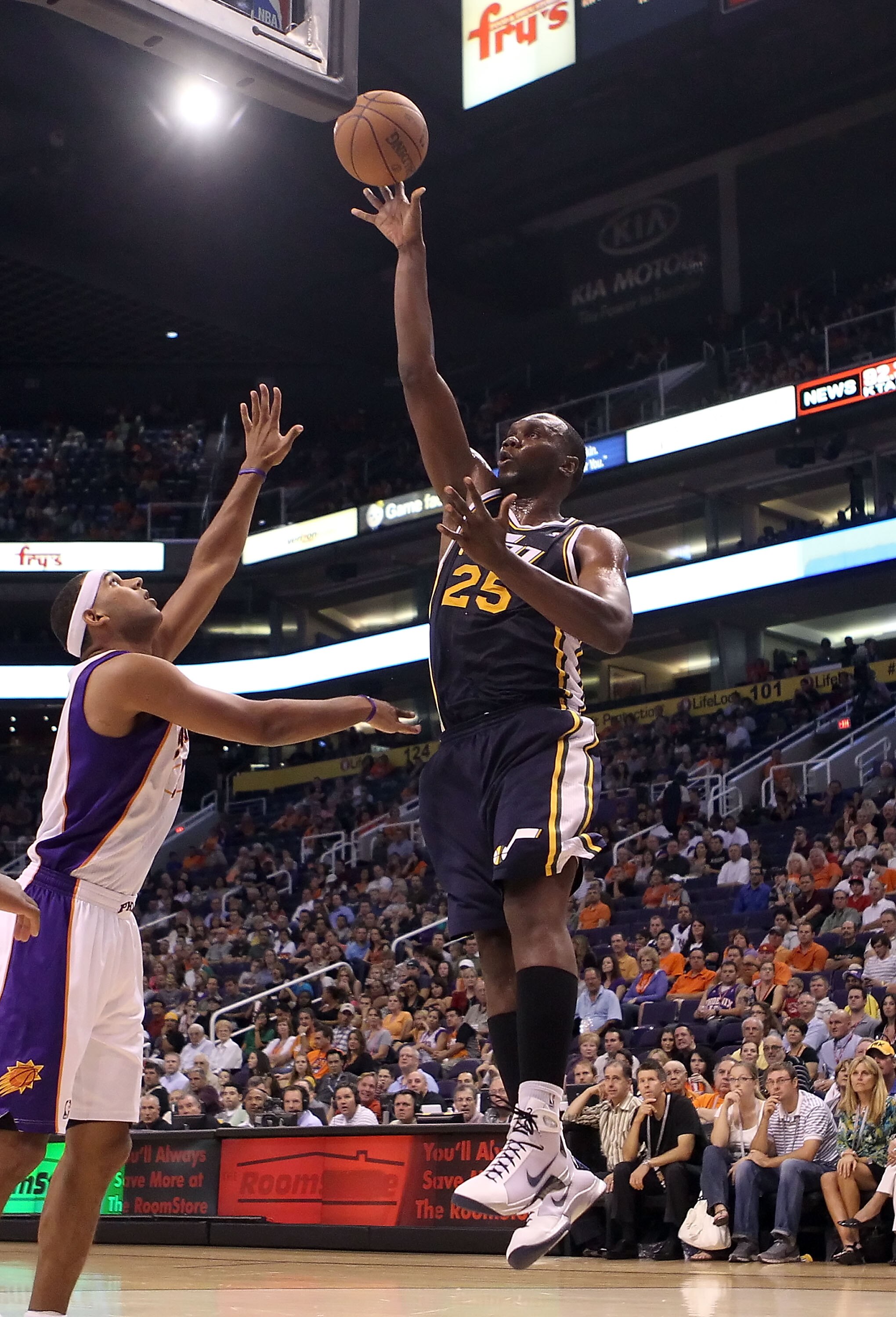 PHOENIX - OCTOBER 12:  Al Jefferson #25 of the Utah Jazz puts up a shot during the preseason NBA game against the Phoenix Suns at US Airways Center on October 12, 2010 in Phoenix, Arizona. NOTE TO USER: User expressly acknowledges and agrees that, by down