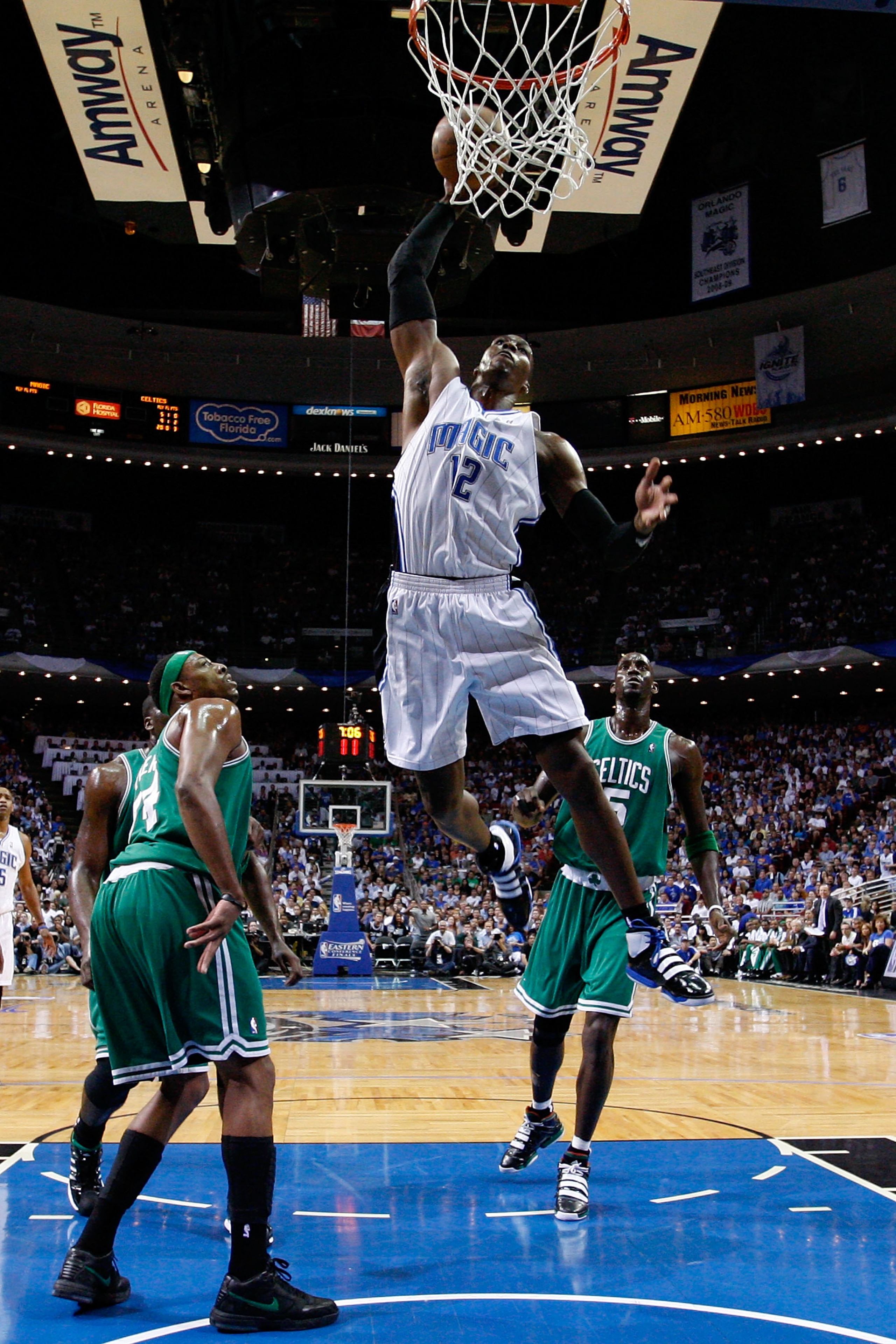 ORLANDO, FL - MAY 26:  Dwight Howard #12 of the Orlando Magic dunks against Paul Pierce #34 and Kevin Garnett #5 of the Boston Celtics in Game Five of the Eastern Conference Finals during the 2010 NBA Playoffs at Amway Arena on May 26, 2010 in Orlando, Fl
