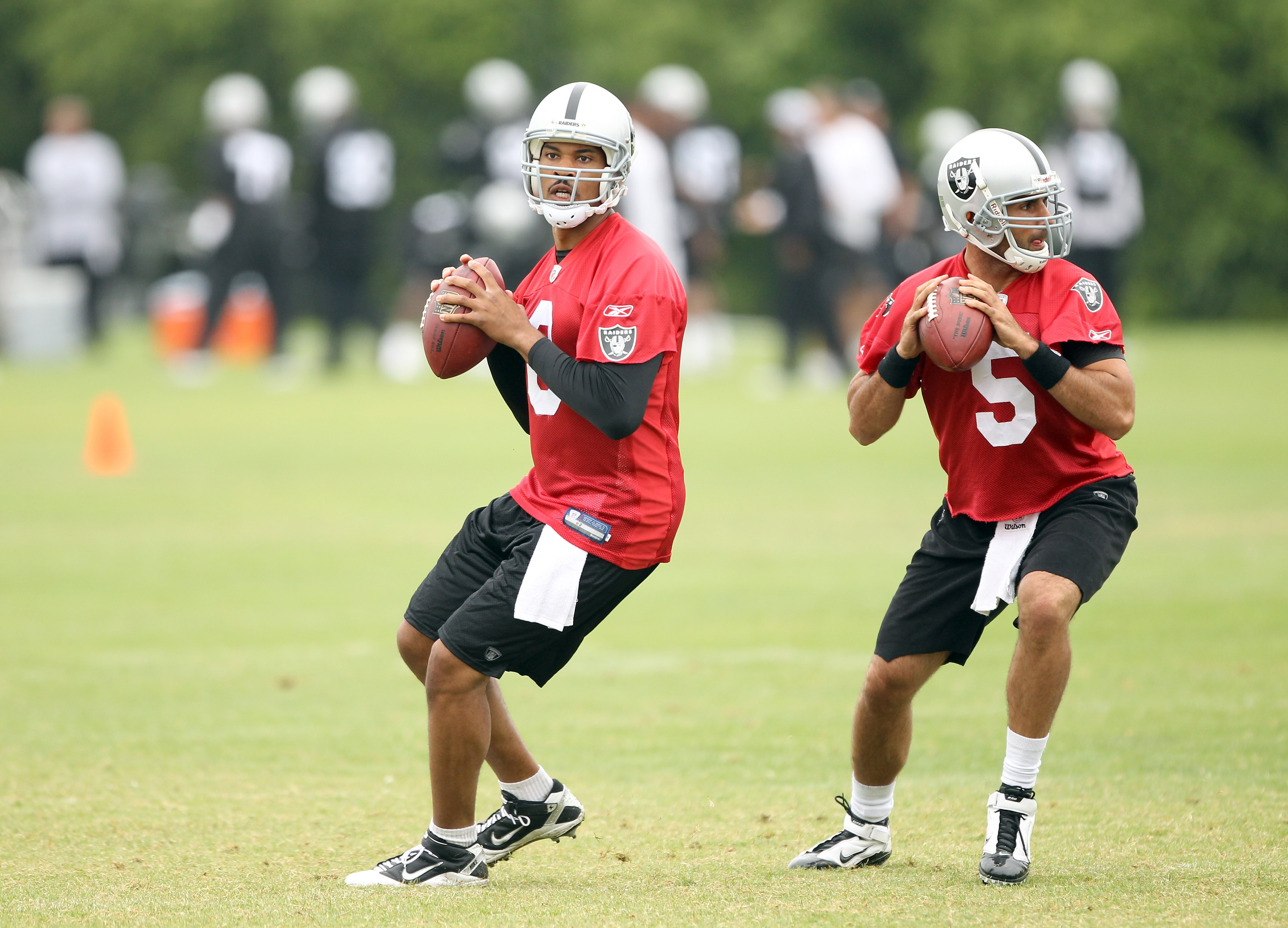 NAPA, CA - AUGUST 01:  Jason Campbell #8 and Bruce Gradkowski #5 of the Oakland Raiders work out during the Raiders training camp at their Napa Valley Training Complex on August 1, 2010 in Napa, California.  (Photo by Ezra Shaw/Getty Images)
