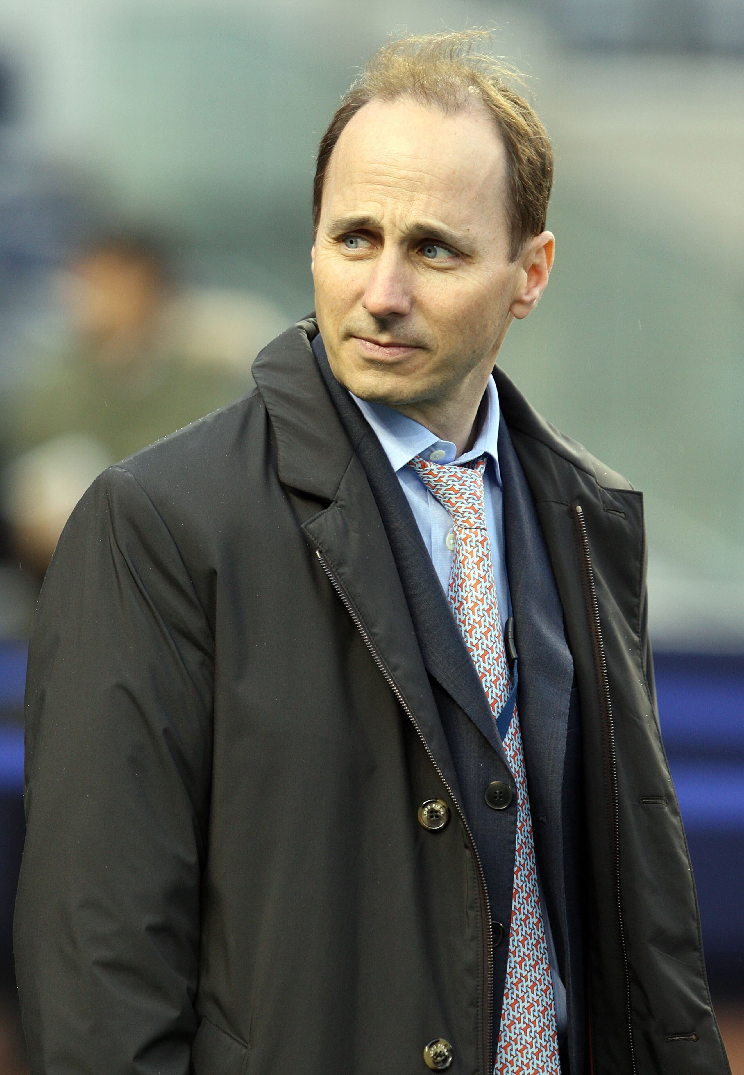 NEW YORK - OCTOBER 16:  General Manager Brian Cashman of the New York Yankees looks on during batting practice before his team plays the Los Angeles Angels of Anaheim in Game One of the ALCS during the 2009 MLB Playoffs on October 16, 2009 at Yankee Stadi