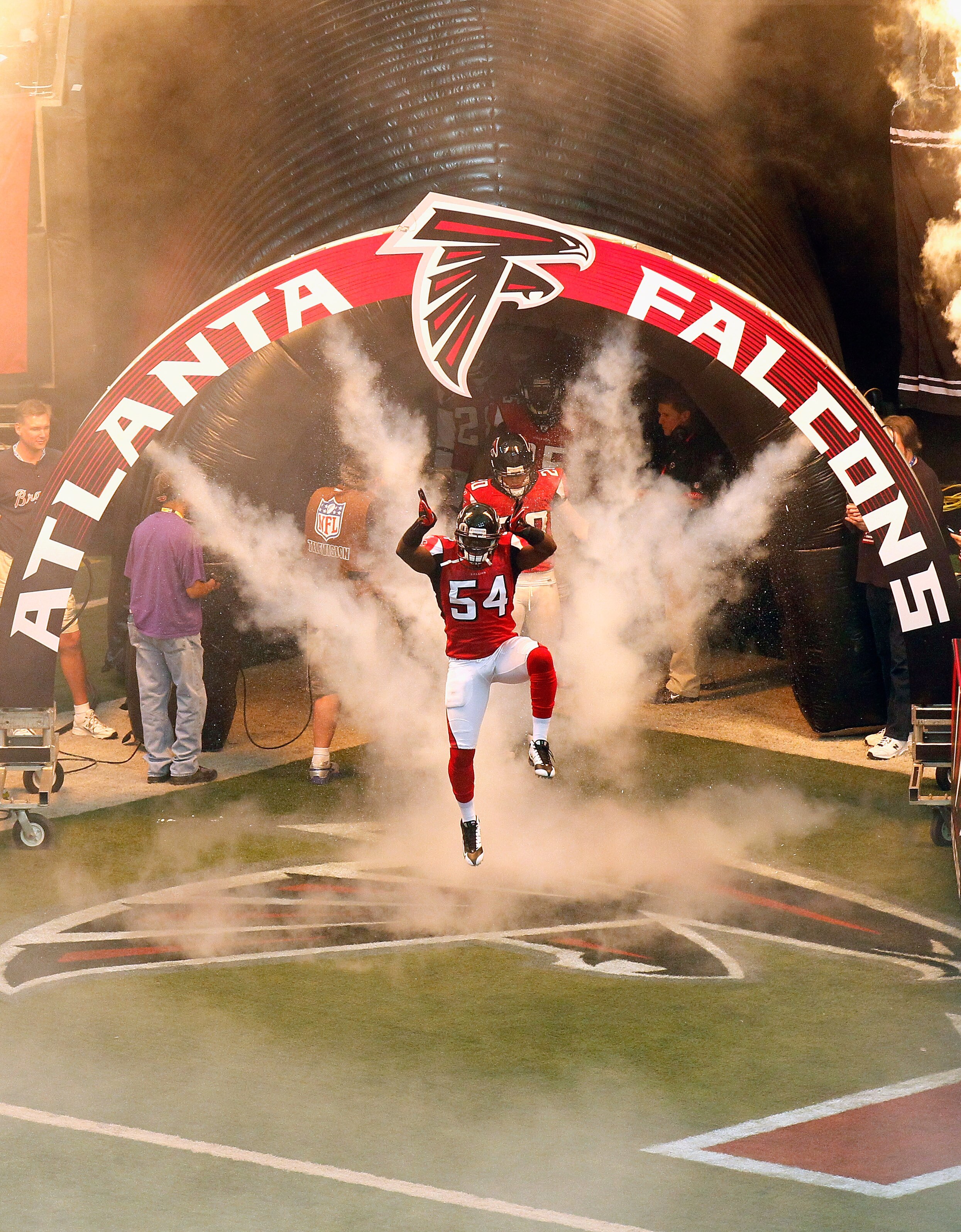 ATLANTA - NOVEMBER 07:  Stephen Nicholas #54 of the Atlanta Falcons enters the field during defensive player introductions before facing the Tampa Bay Buccaneers at Georgia Dome on November 7, 2010 in Atlanta, Georgia.  (Photo by Kevin C. Cox/Getty Images