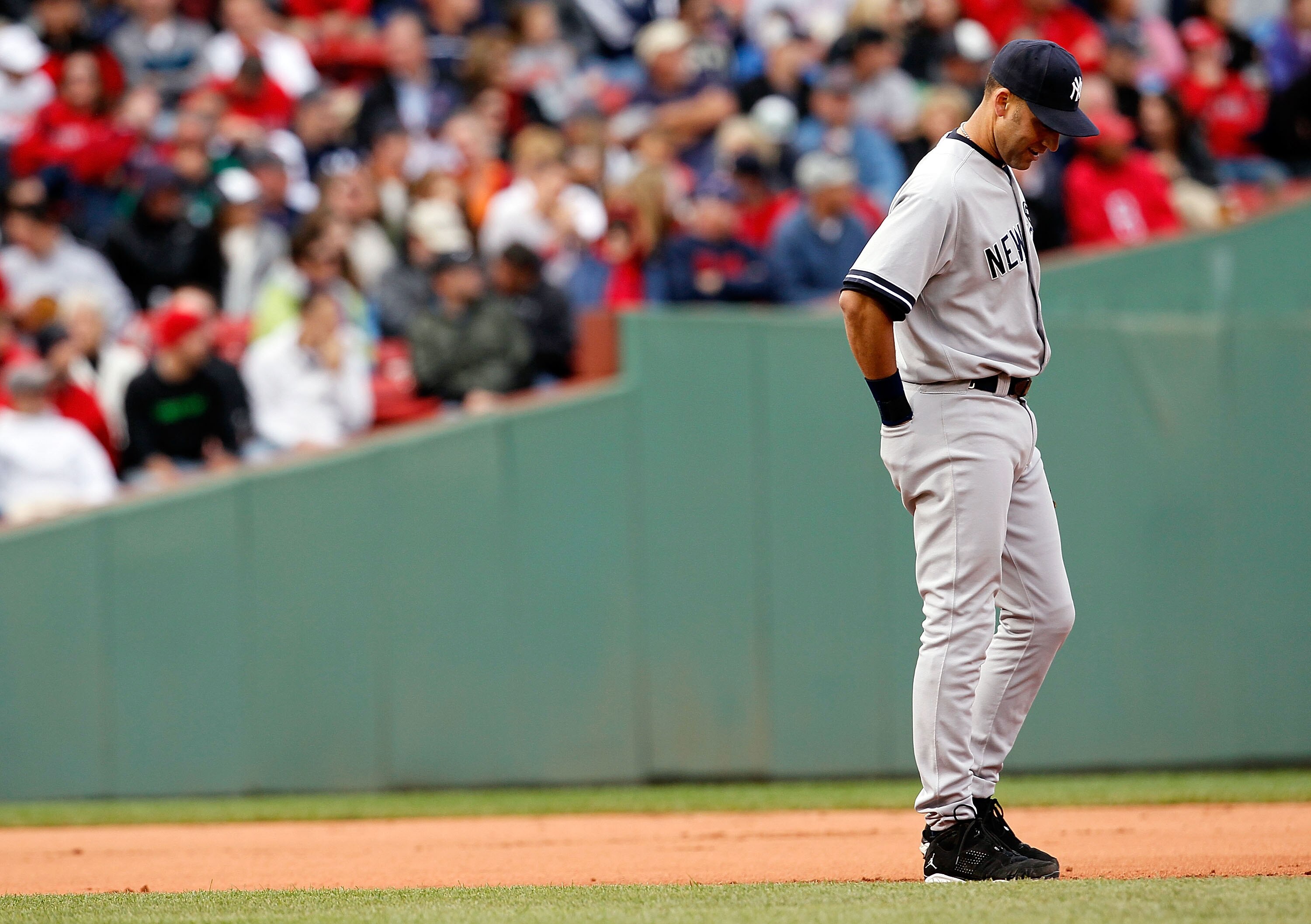 BOSTON - OCTOBER 3:  Derek Jeter #2 of the New York Yankees takes a breather during a pitching change during a game against the Boston Red Sox at Fenway Park, October 3, 2010, in Boston, Massachusetts. (Photo by Jim Rogash/Getty Images)