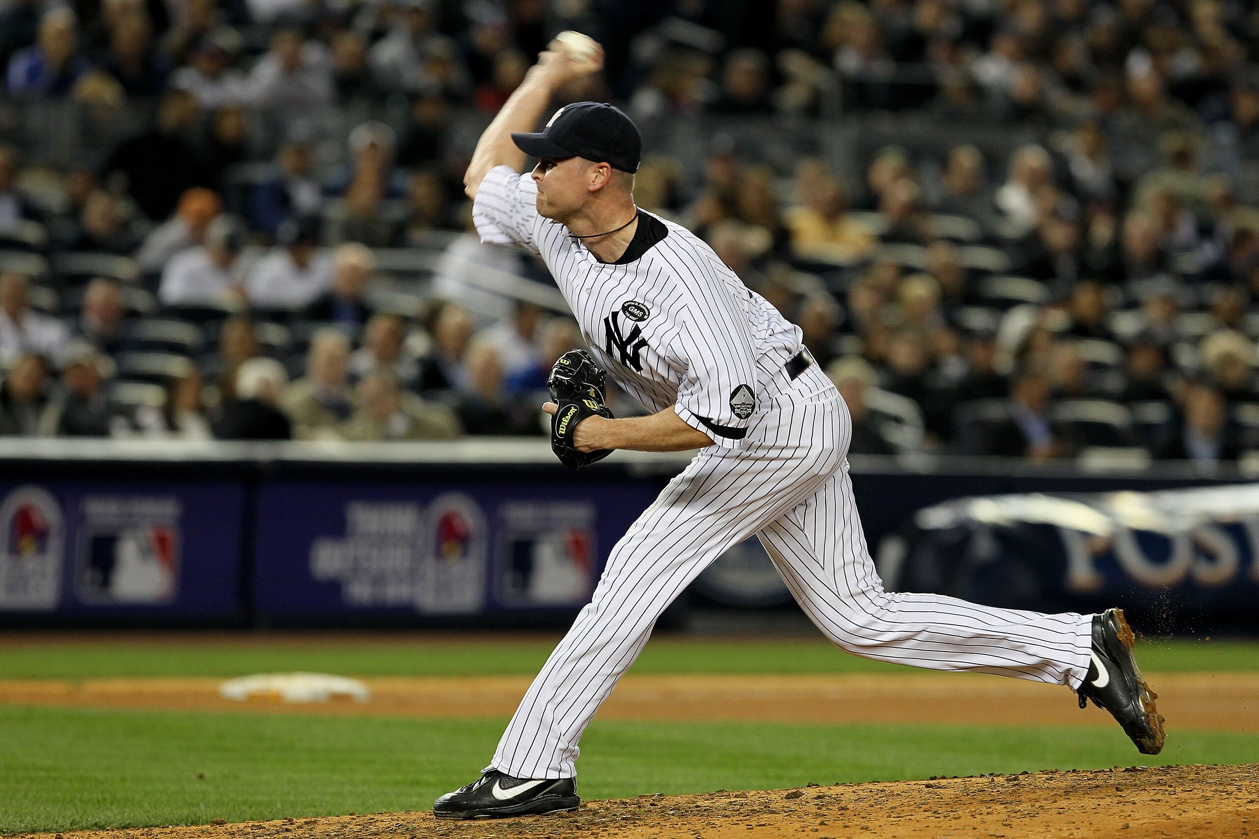 NEW YORK - OCTOBER 20:  Kerry Wood #39 of the New York Yankees pitches against the Texas Rangers in Game Five of the ALCS during the 2010 MLB Playoffs at Yankee Stadium on October 20, 2010 in the Bronx borough of New York City.  (Photo by Jim McIsaac/Gett