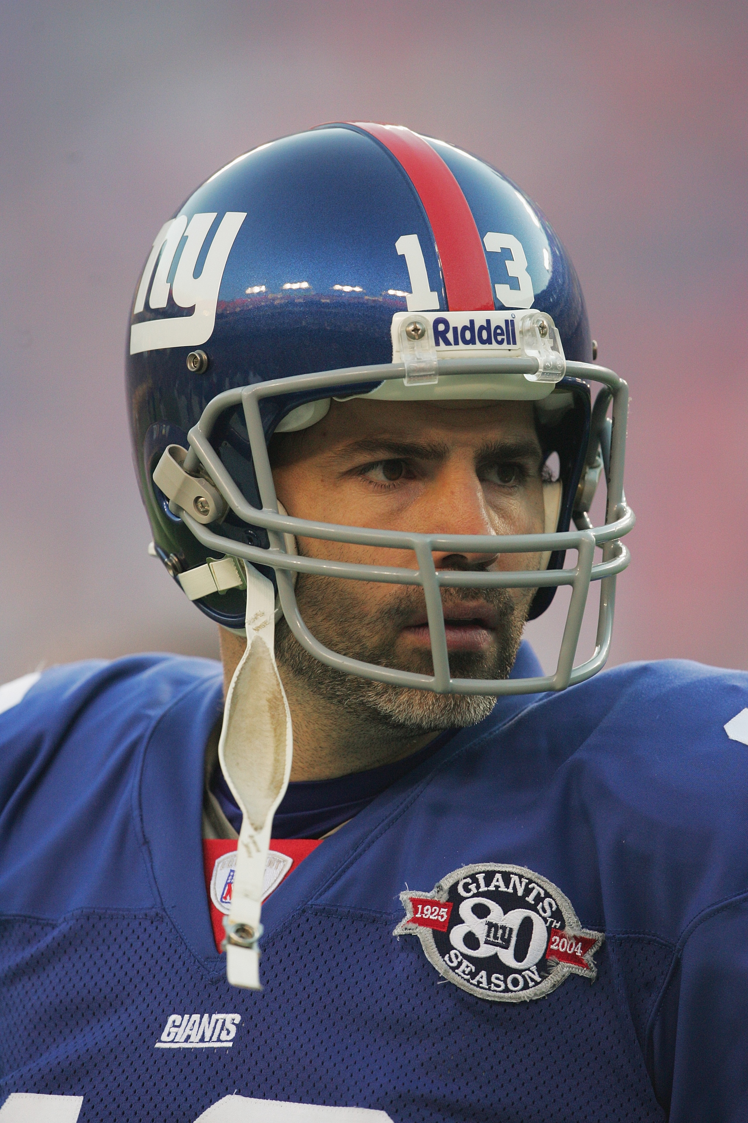 LANDOVER,MD - DECEMBER 5:  Quarterback Kurt Warner #13 of the New York Giants stands on the sideline during the game against the Washington Redskins at Fed Ex Field on December 5, 2004 in Landover, Maryland. The Redskins won 31-7. (Photo by Jamie Squire/G