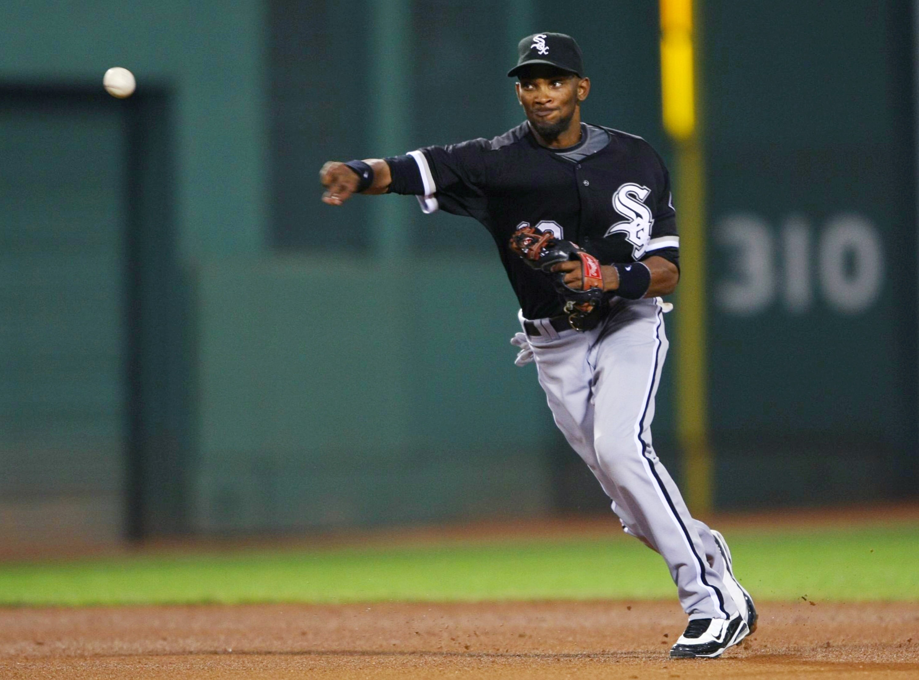 BOSTON - AUGUST 26:  Alexei Ramirez #10 of the Chicago White Sox throws to first base in the fourth inning during the game against the Boston Red Sox on August 26, 2009 at Fenway Park in Boston, Massachusetts. (Photo by: Elsa/Getty Images)