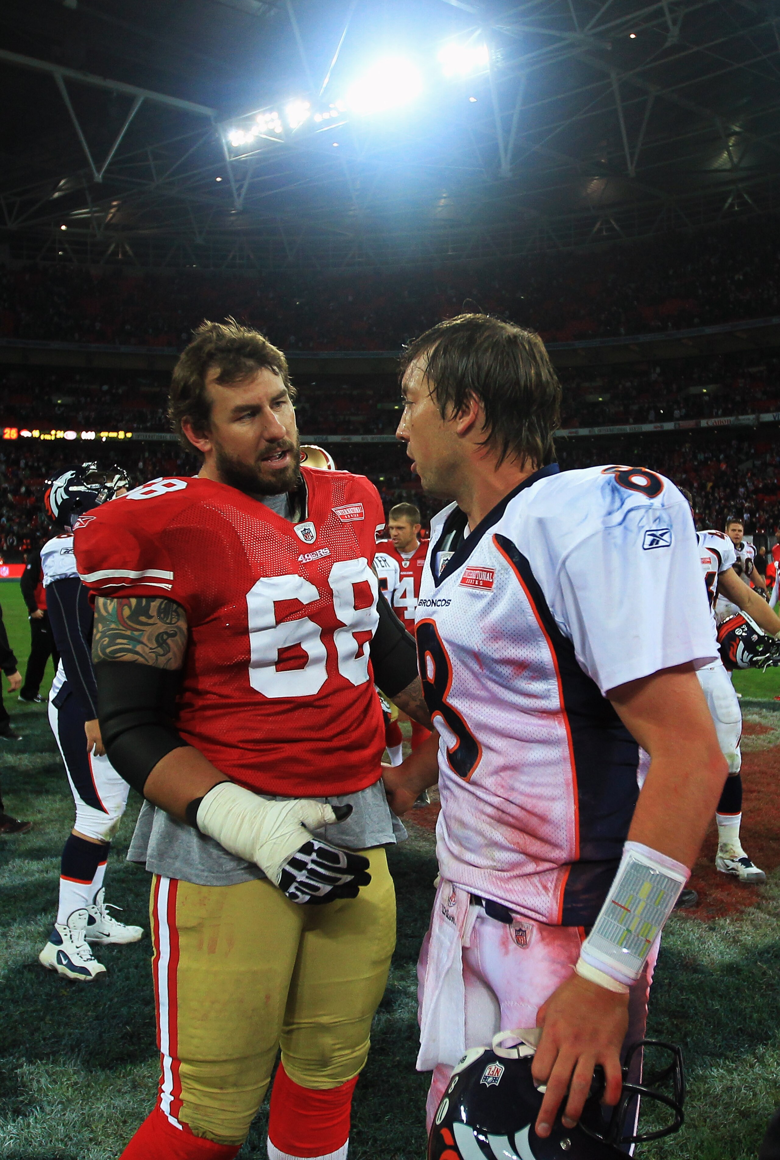 LONDON, ENGLAND - OCTOBER 31: Quarterback Kyle Orton #8 of Denver Broncos and Adam Snyder #68 of San Francisco 49ers talk after the NFL International Series match between Denver Broncos and San Francisco 49ers at Wembley Stadium on October 31, 2010 in Lo LONDON, ENGLAND - OCTOBER 31: Quarterback Kyle Orton #8 of Denver Broncos and Adam Snyder #68 of San Francisco 49ers talk after the NFL International Series match between Denver Broncos and San Francisco 49ers at Wembley Stadium on October 31, 2010 in Lo