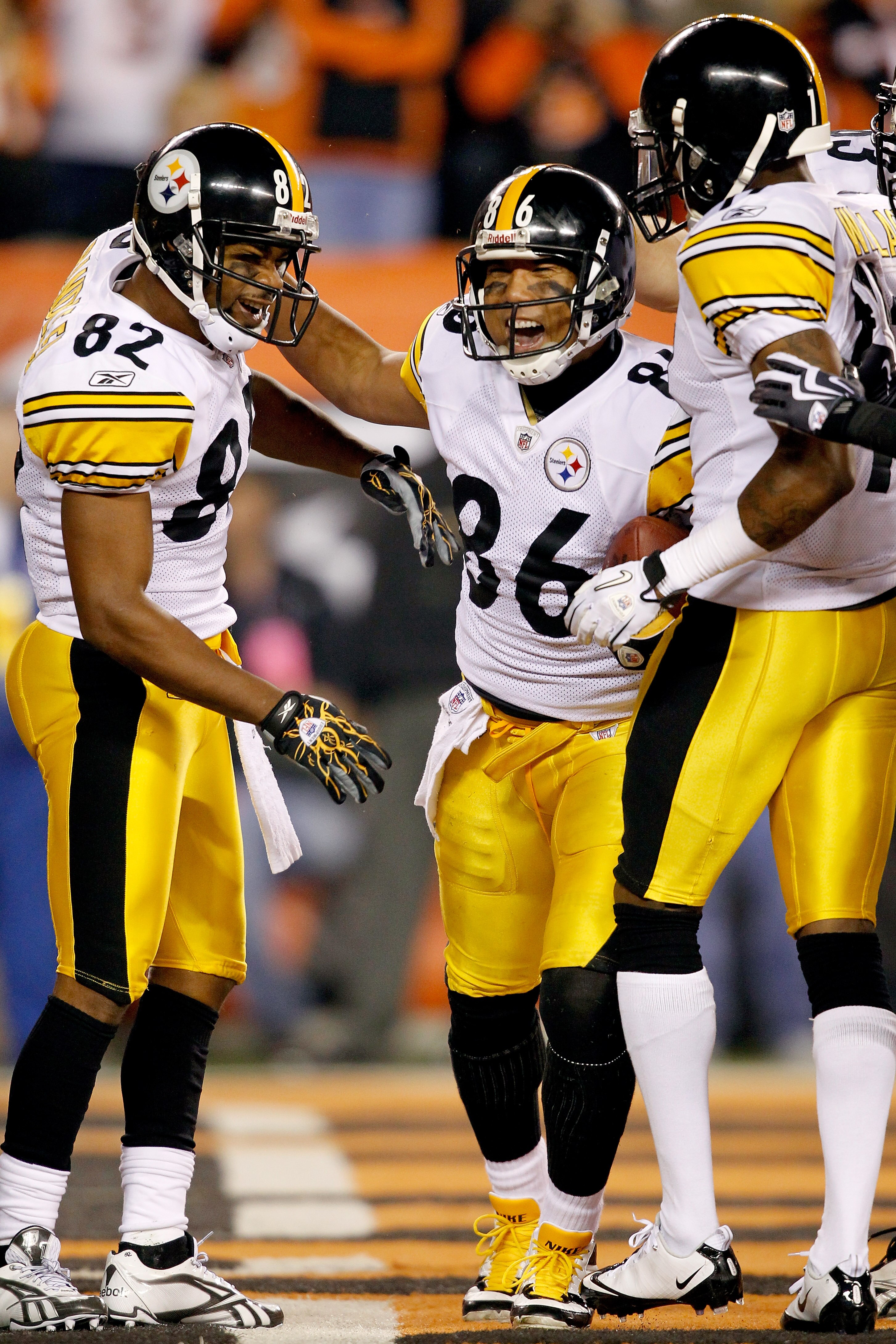 CINCINNATI - NOVEMBER 08:  Hines Ward #86 of the Pittsburgh Steelers celebrates in the endzone with Antwaan Randle El #82 and Mike Wallace #17 after scoring a touchdown against the Cincinnati Bengals at Paul Brown Stadium on November 8, 2010 in Cincinnati