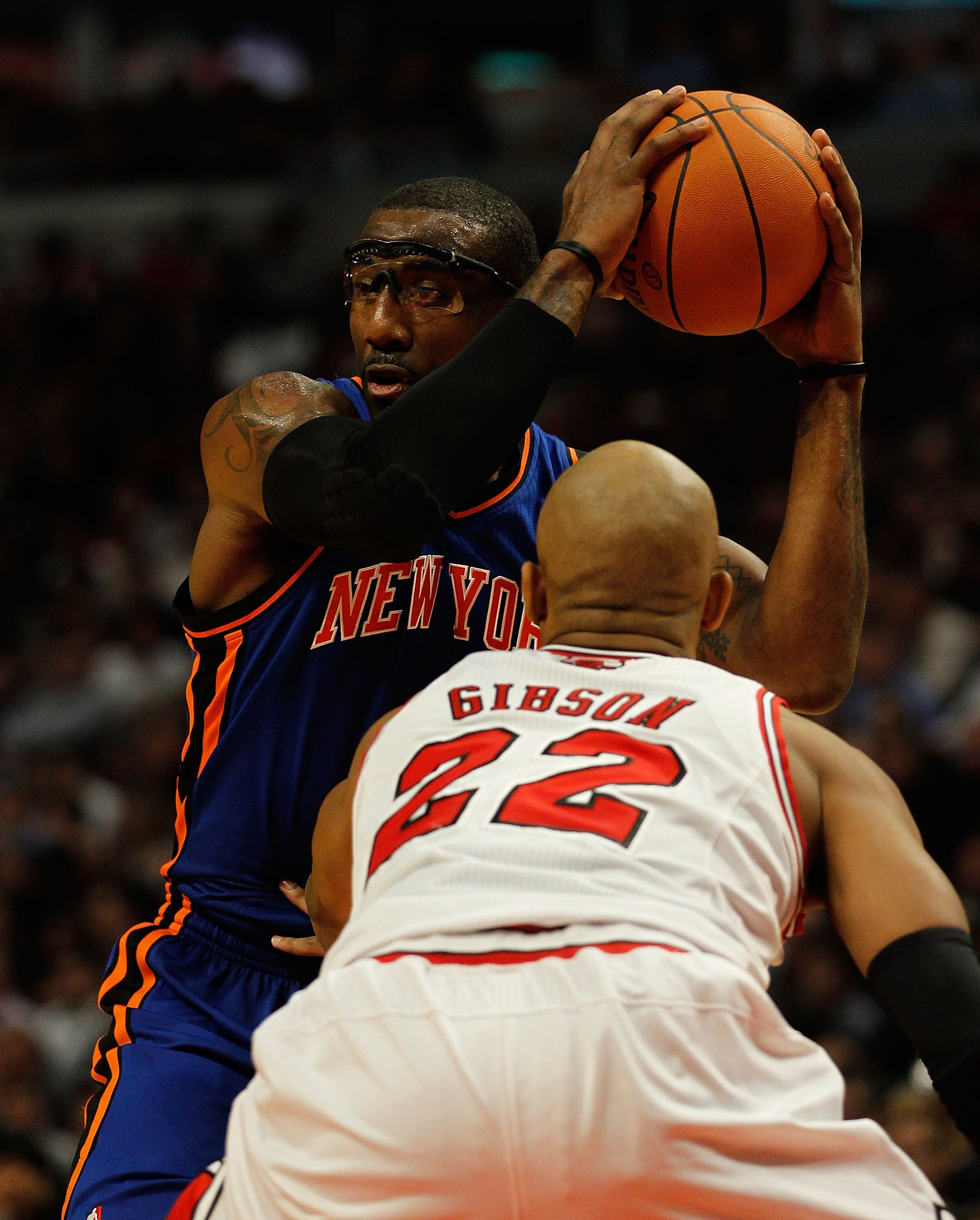 CHICAGO - NOVEMBER 04: Amar'e Stoudemire #1 of the New York Knicks looks to pass under pressure from Taj Gibson #22 of the Chicago Bulls at the United Center on November 4, 2010 in Chicago, Illinois. The Knicks defeated the Bulls 120-112. NOTE TO USER: Us