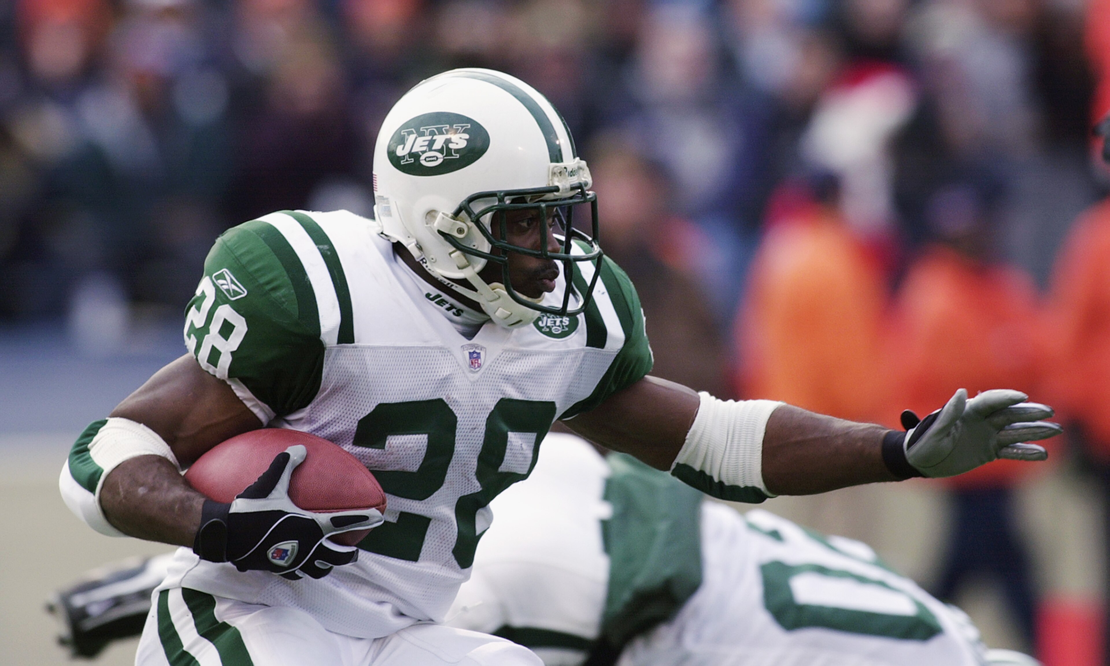 CHAMPAIGN, IL - DECEMBER 15:  Running back Curtis Martin #28 of the New York Jets runs the ball against the Chicago Bears during their NFL game on December 15, 2002 at Memorial Stadium at the University of Illinois in Champaign, Illinois.  The Bears defea