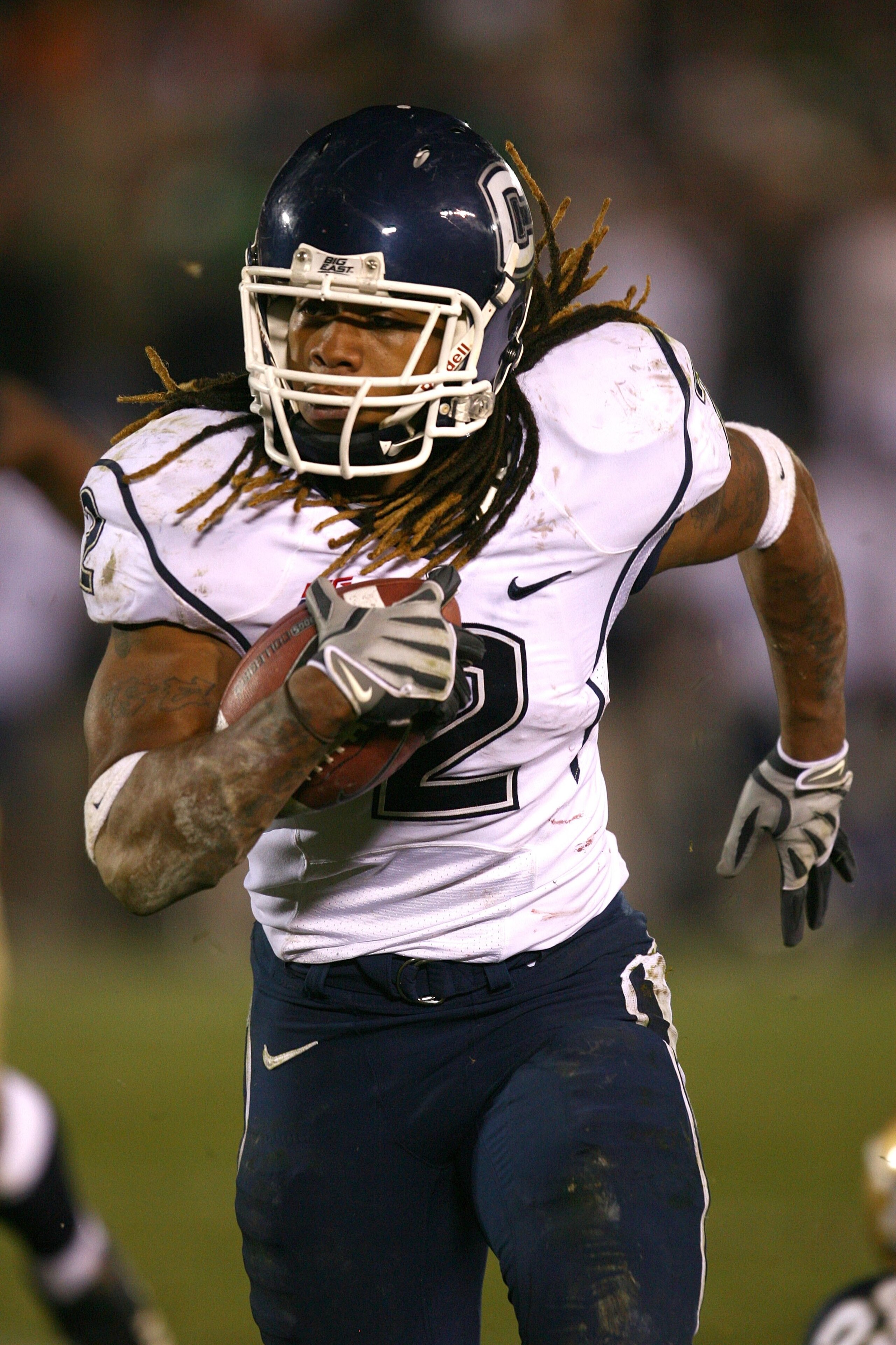 SOUTH BEND, IN - NOVEMBER 21: Andre Dixon #2 of the Univeristy of Connecticut Huskies runs with the ball against the Notre Dame Fighting Irish at Notre Dame Stadium on November 21, 2009 in South Bend, Indiana. Connecticut defeated Notre Dame 33-30 in over