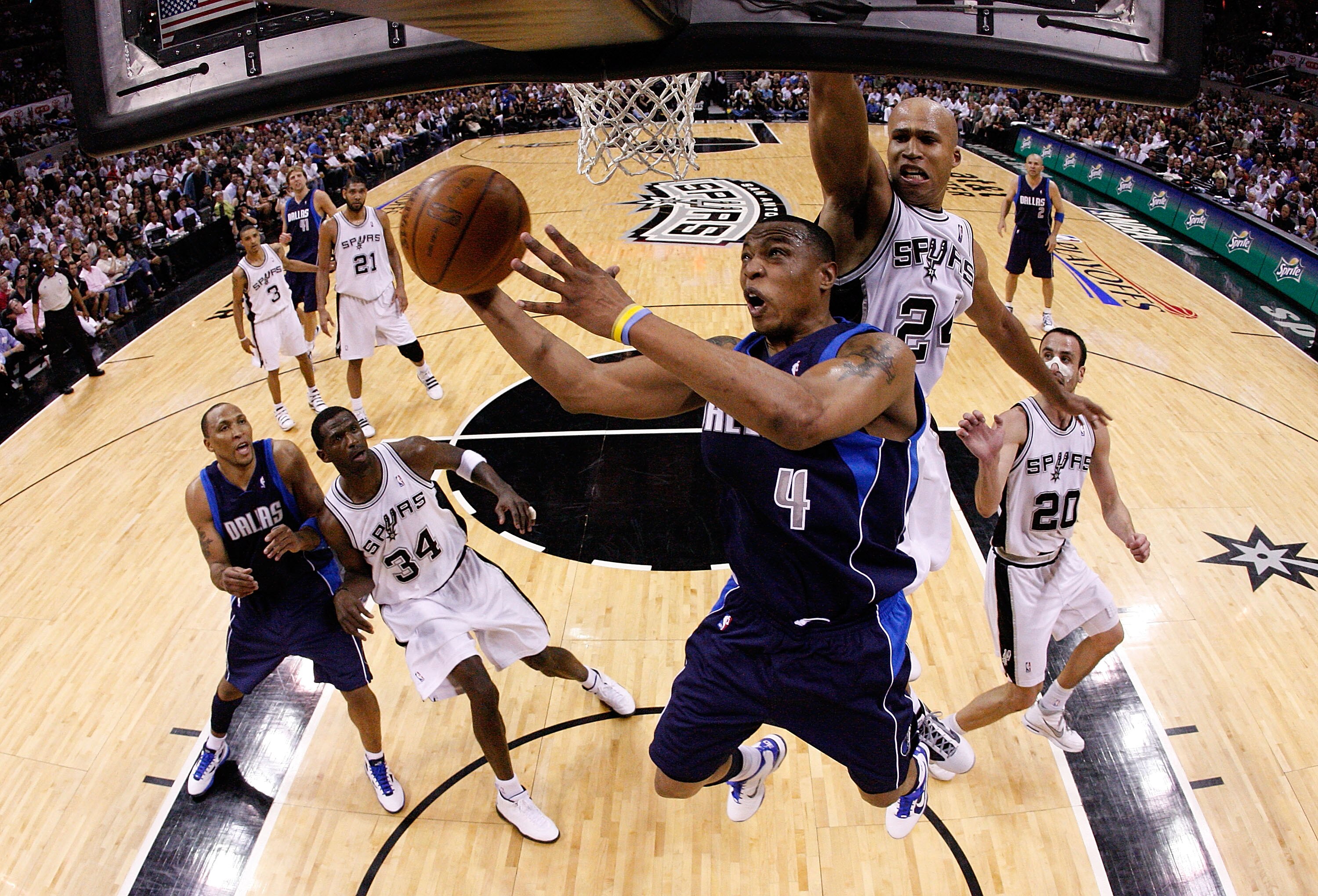 SAN ANTONIO - APRIL 29:  Forward Caron Butler #4 of the Dallas Mavericks takes a shot against Richard Jefferson #24 of the San Antonio Spurs in Game Six of the Western Conference Quarterfinals during the 2010 NBA Playoffs at AT&T Center on April 29, 2010