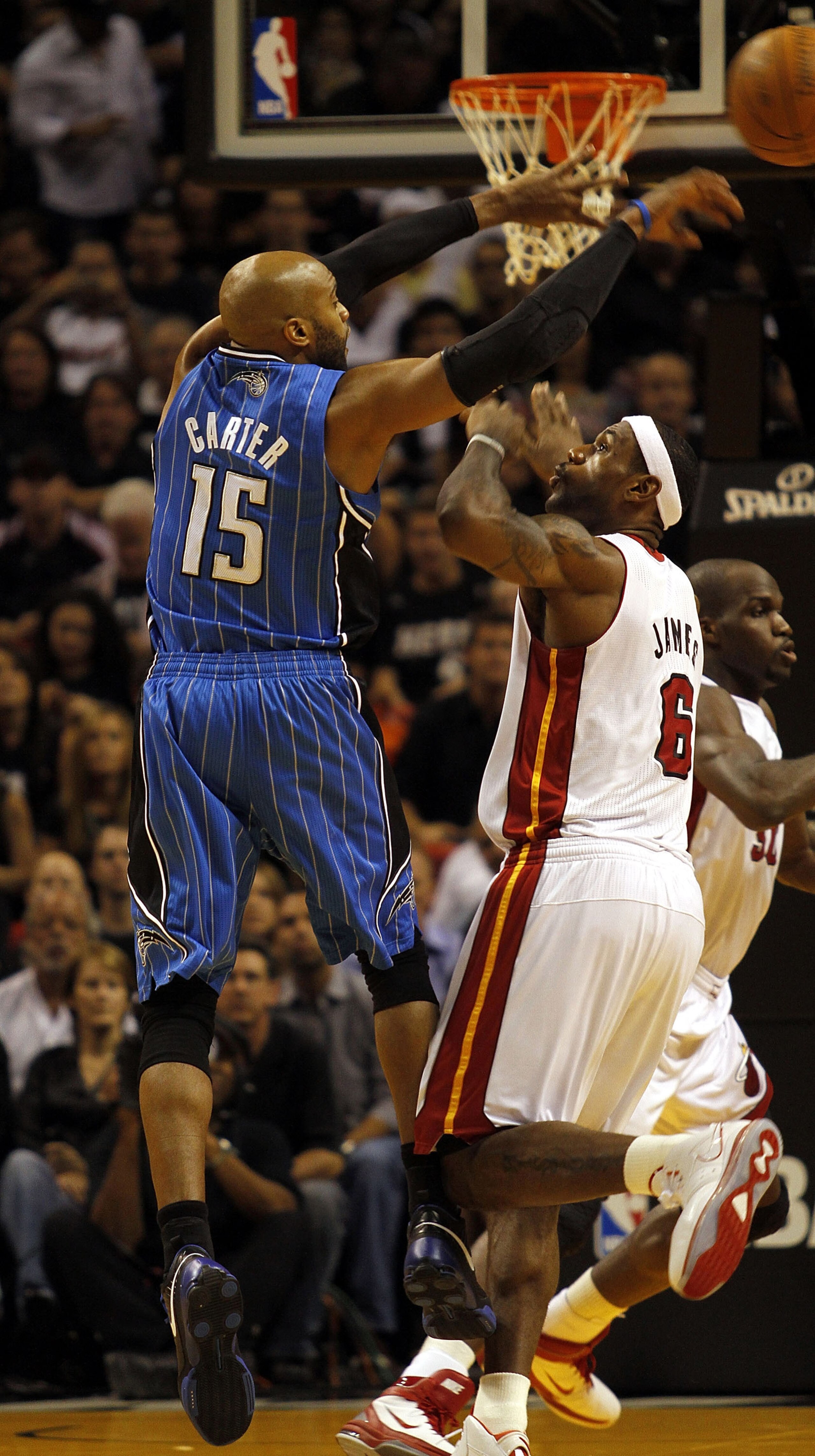 MIAMI - OCTOBER 29:  Forward LeBron James #6 of  the Miami Heat defends against guard Vince Carter #15 of the Orlando Magic at American Airlines Arena on October 29, 2010 in Miami, Florida.  NOTE TO USER: User expressly acknowledges and agrees that, by do