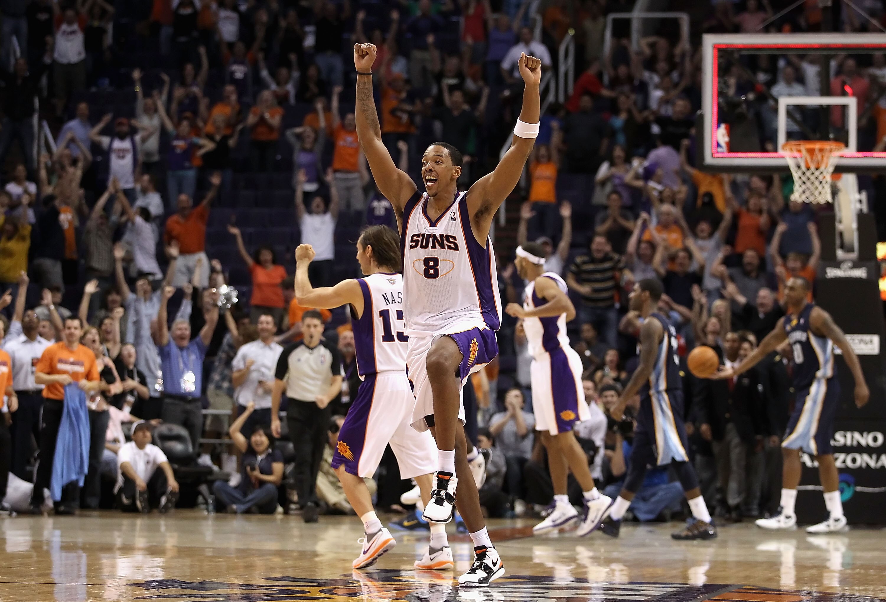 PHOENIX - NOVEMBER 05:  Channing Frye #8 of the Phoenix Suns celebrates after Jason Richardson tied the game in the final seconds to force overtime against the Memphis Grizzlies during the NBA game at US Airways Center on November 5, 2010 in Phoenix, Ariz