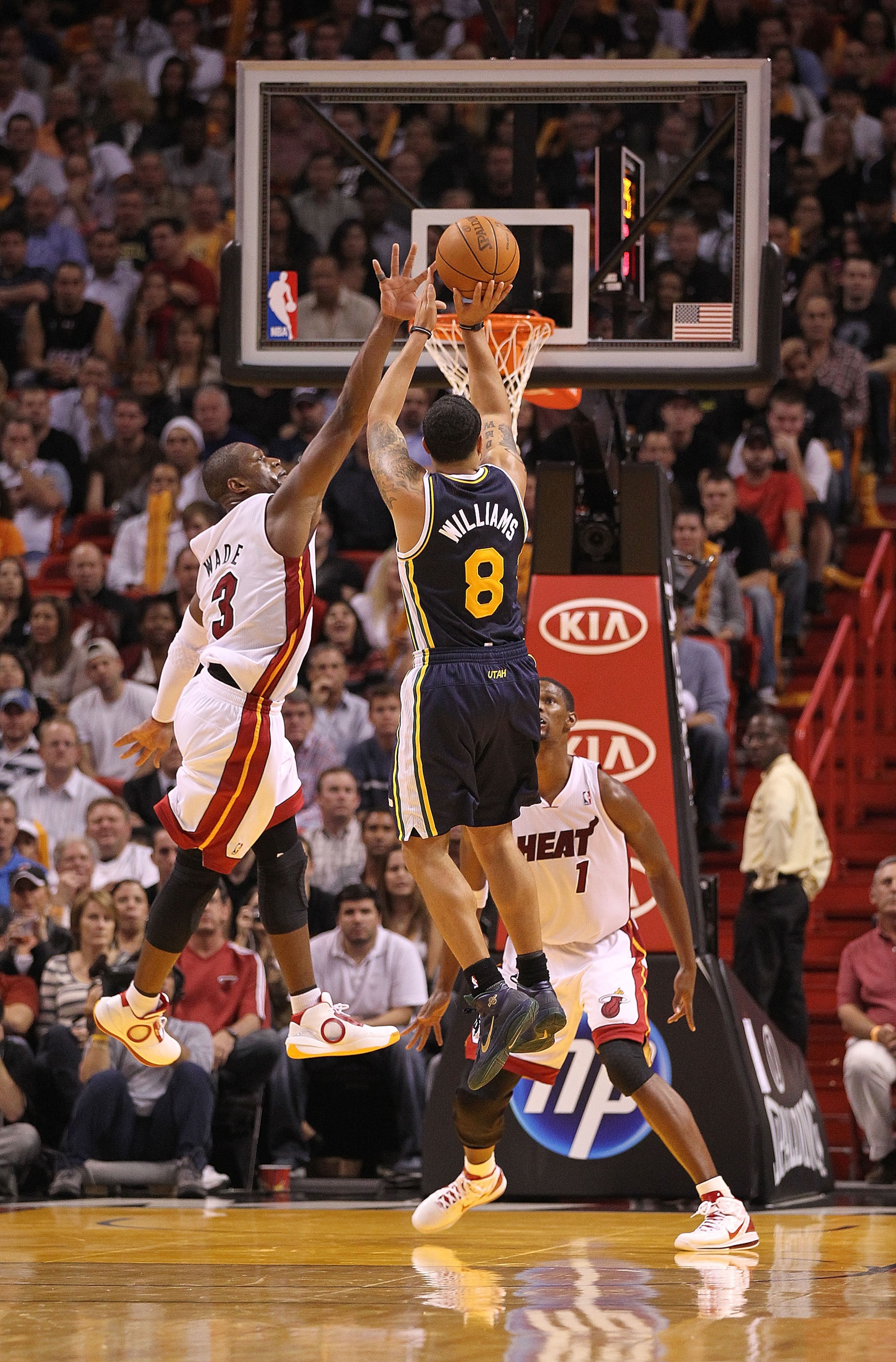 MIAMI - NOVEMBER 09:  Deron Williams #8 of the Utah Jazz shoots over Dwayne Wade #3 during a game agsinst the Miami Heat at American Airlines Arena on November 9, 2010 in Miami, Florida. NOTE TO USER: User expressly acknowledges and agrees that, by downlo