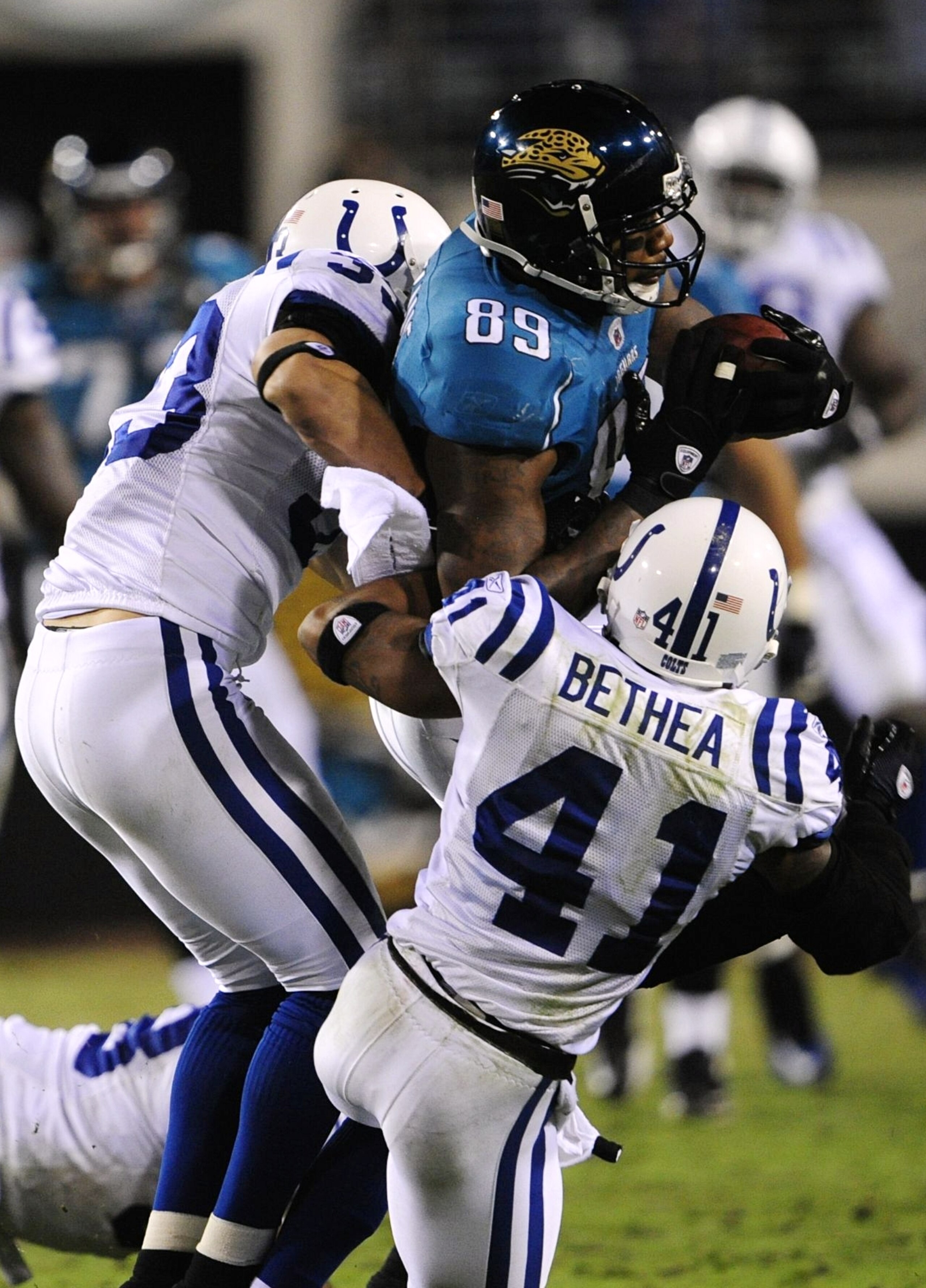 JACKSONVILLE, FL - DECEMBER 17: Marcedes Lewis #89 of the Jacksonville Jaguars makes a reception against Tim Jennings #23 and #41 of the Indianapolis Colts at Jacksonville Municipal Stadium on December 17, 2009 in Jacksonville, Florida. (Photo by Sam Gr JACKSONVILLE, FL - DECEMBER 17: Marcedes Lewis #89 of the Jacksonville Jaguars makes a reception against Tim Jennings #23 and #41 of the Indianapolis Colts at Jacksonville Municipal Stadium on December 17, 2009 in Jacksonville, Florida. (Photo by Sam Gr