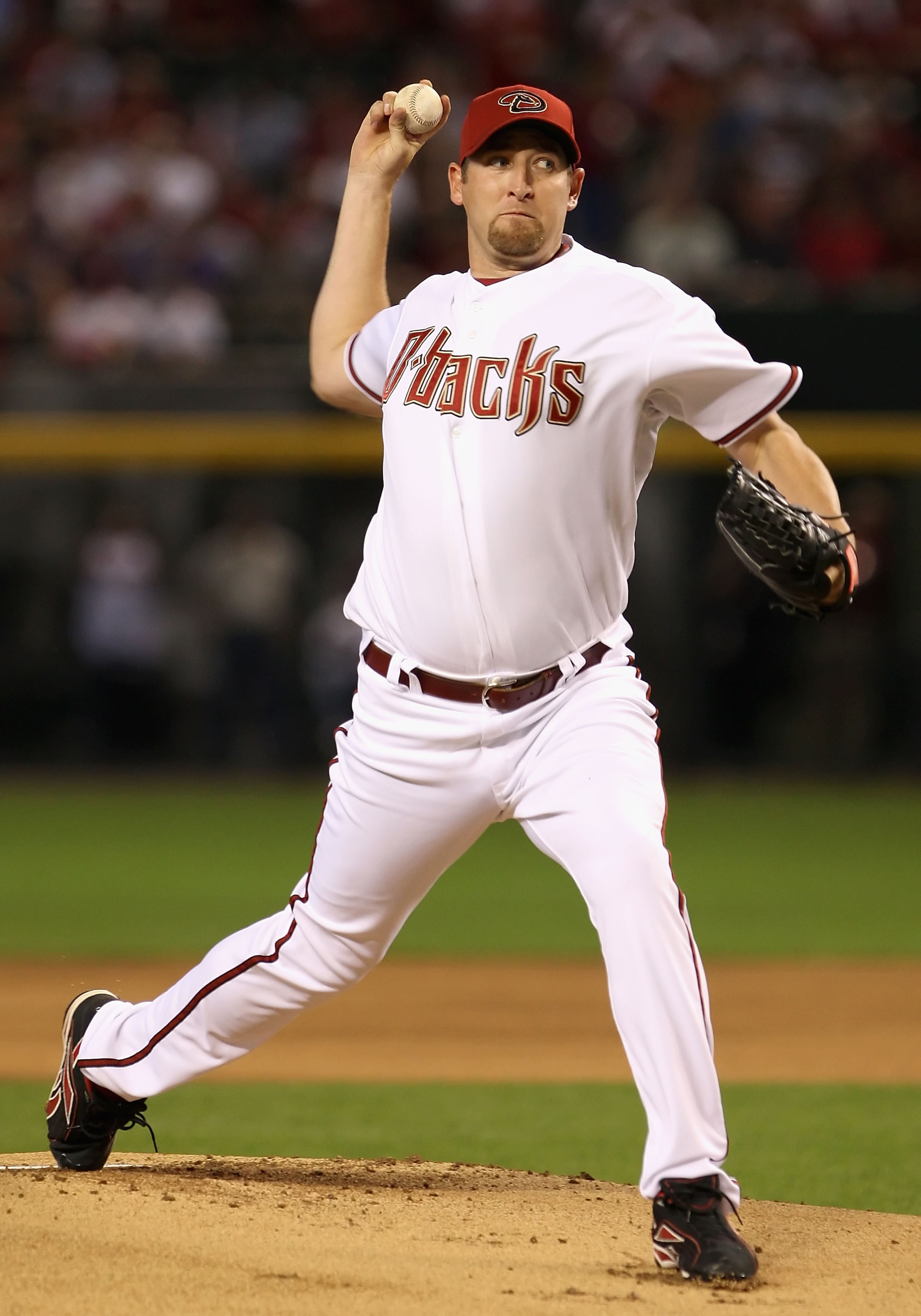 PHOENIX - APRIL 06:  Starting pitcher Brandon Webb #17 of the Arizona Diamondbacks throws the first pitch of the MLB openning day game against the Colorado Rockies at Chase Field on April 6, 2009 in Phoenix, Arizona.  (Photo by Christian Petersen/Getty Im