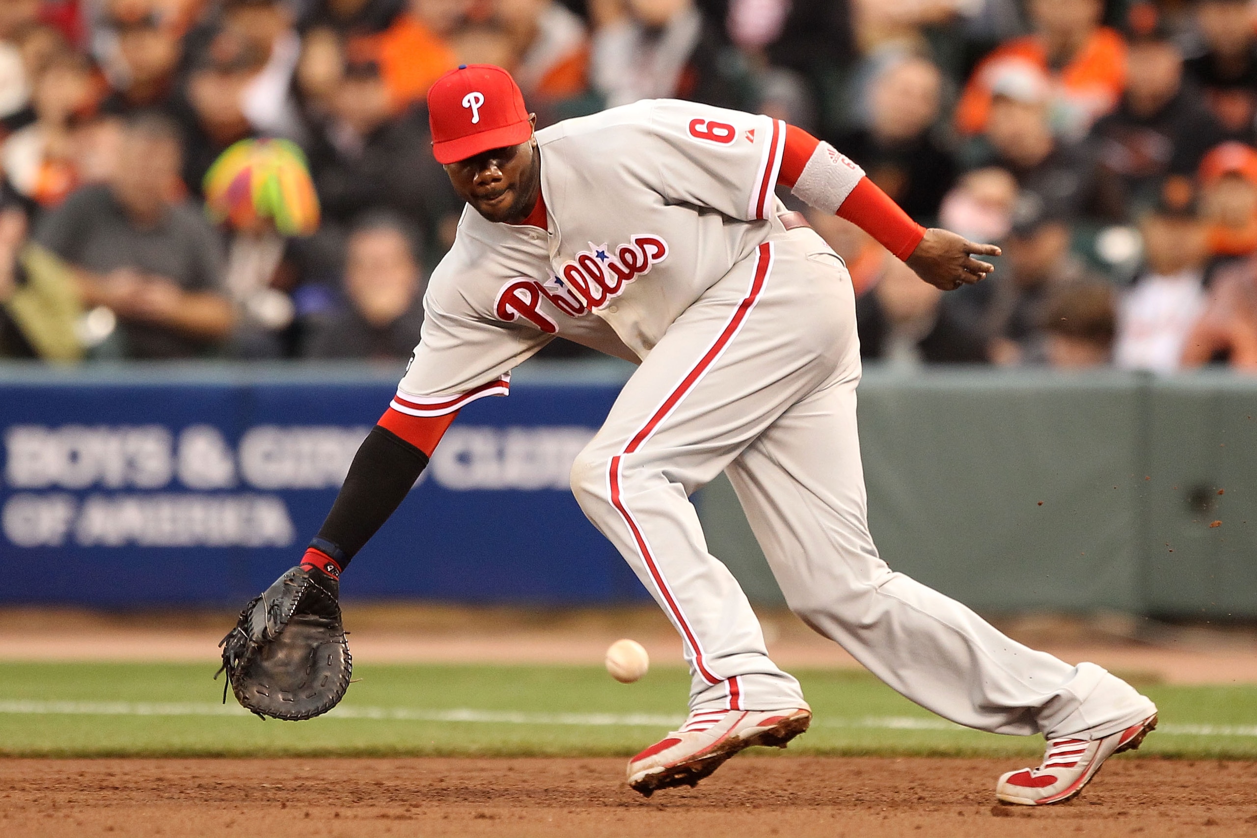 SAN FRANCISCO - OCTOBER 21:  Ryan Howard #6 of the Philadelphia Phillies fields a ball against the San Francisco Giants in Game Five of the NLCS during the 2010 MLB Playoffs at AT&T Park on October 21, 2010 in San Francisco, California.  (Photo by Ezra Sh