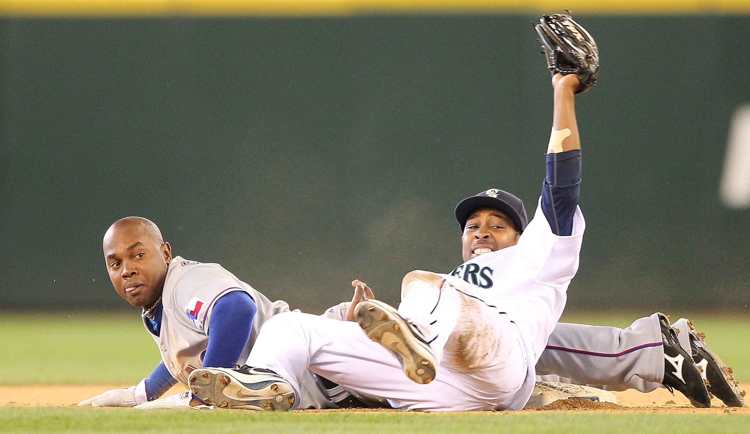 SEATTLE - SEPTEMBER 19:  Esteban German #6 of the Texas Rangers is tagged out on a steal attempt at second base by Chone Figgins #9 of the Seattle Mariners at Safeco Field on September 19, 2010 in Seattle, Washington. The Mariners defeated the Rangers 2-1