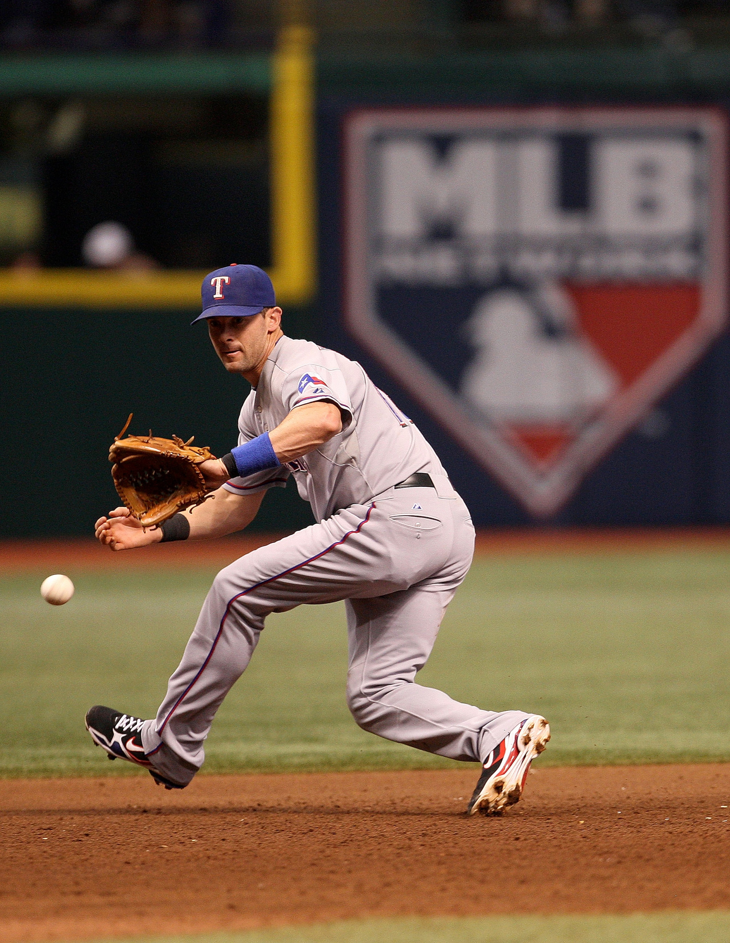 ST PETERSBURG, FL - OCTOBER 07:  Michael Young #10 of the Texas Rangers fields a ground ball during Game 2 of the ALDS against the Tampa Bay Rays at Tropicana Field on October 7, 2010 in St. Petersburg, Florida.  (Photo by Mike Ehrmann/Getty Images)