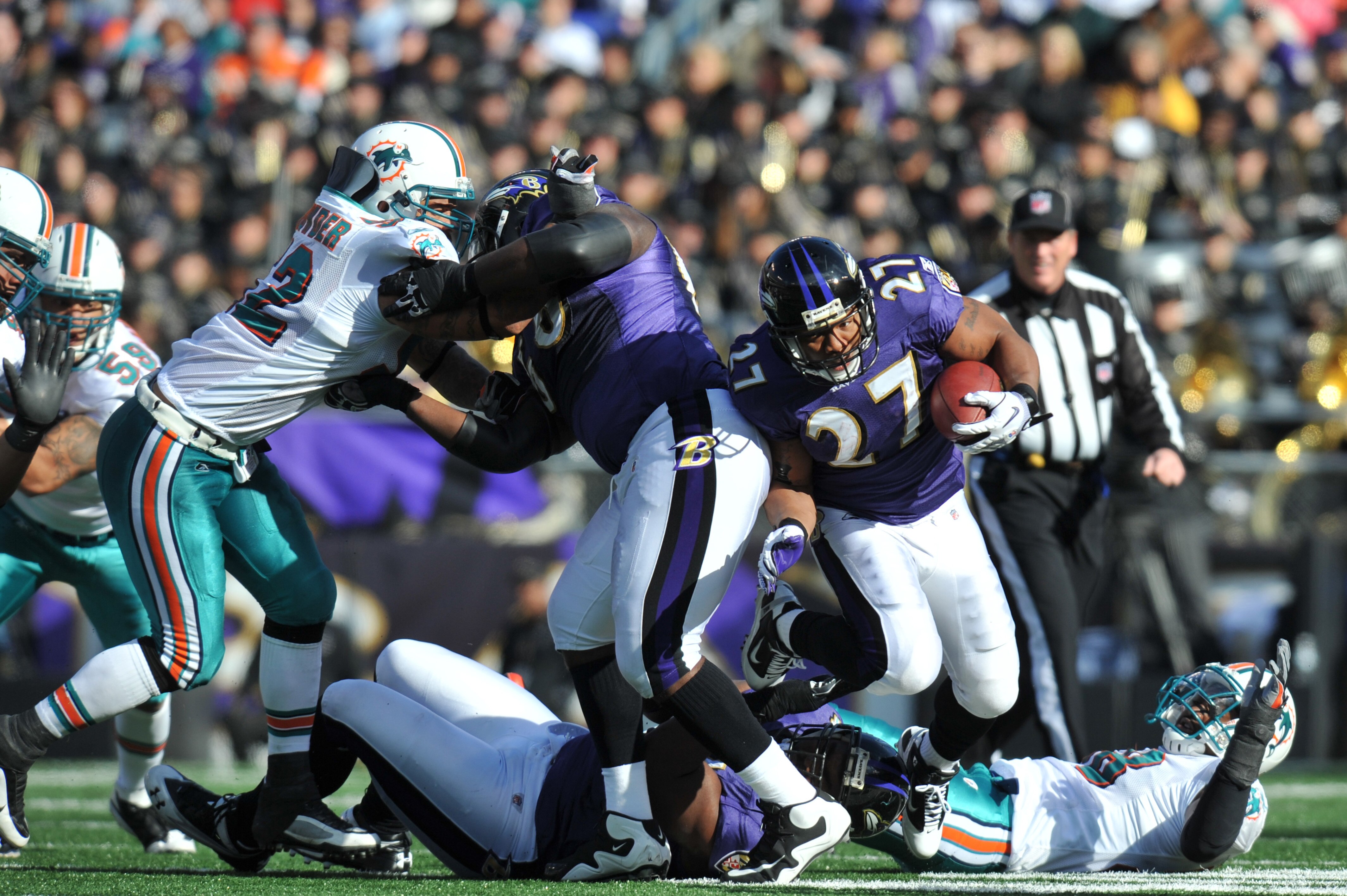 BALTIMORE, MD - NOVEMBER 7:  Ray Rice #27 of the Baltimore Ravens runs the ball against the Miami Dolphins at M&T Bank Stadium on November 7, 2010 in Baltimore, Maryland. The Ravens defeated the Dolphins 26-10. (Photo by Larry French/Getty Images)