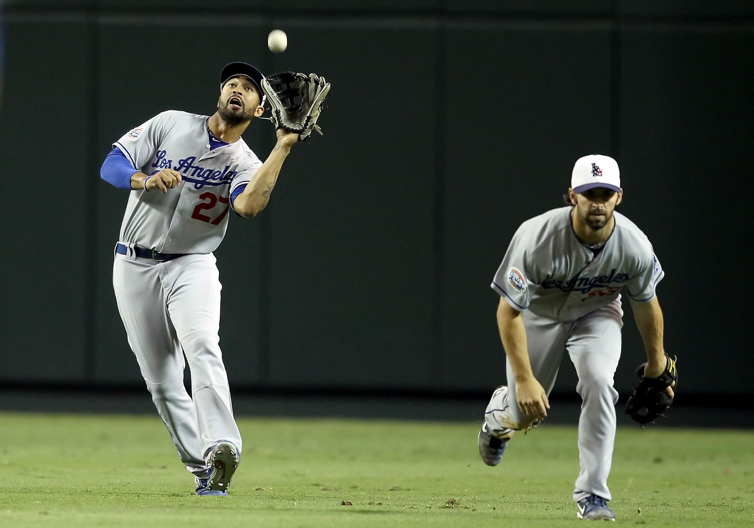 PHOENIX - JULY 03:  Outfielder Matt Kemp #27 of the Los Angeles Dodgers catches a fly ball out against the Arizona Diamondbacks during the Major League Baseball game at Chase Field on July 3, 2010 in Phoenix, Arizona.  (Photo by Christian Petersen/Getty I
