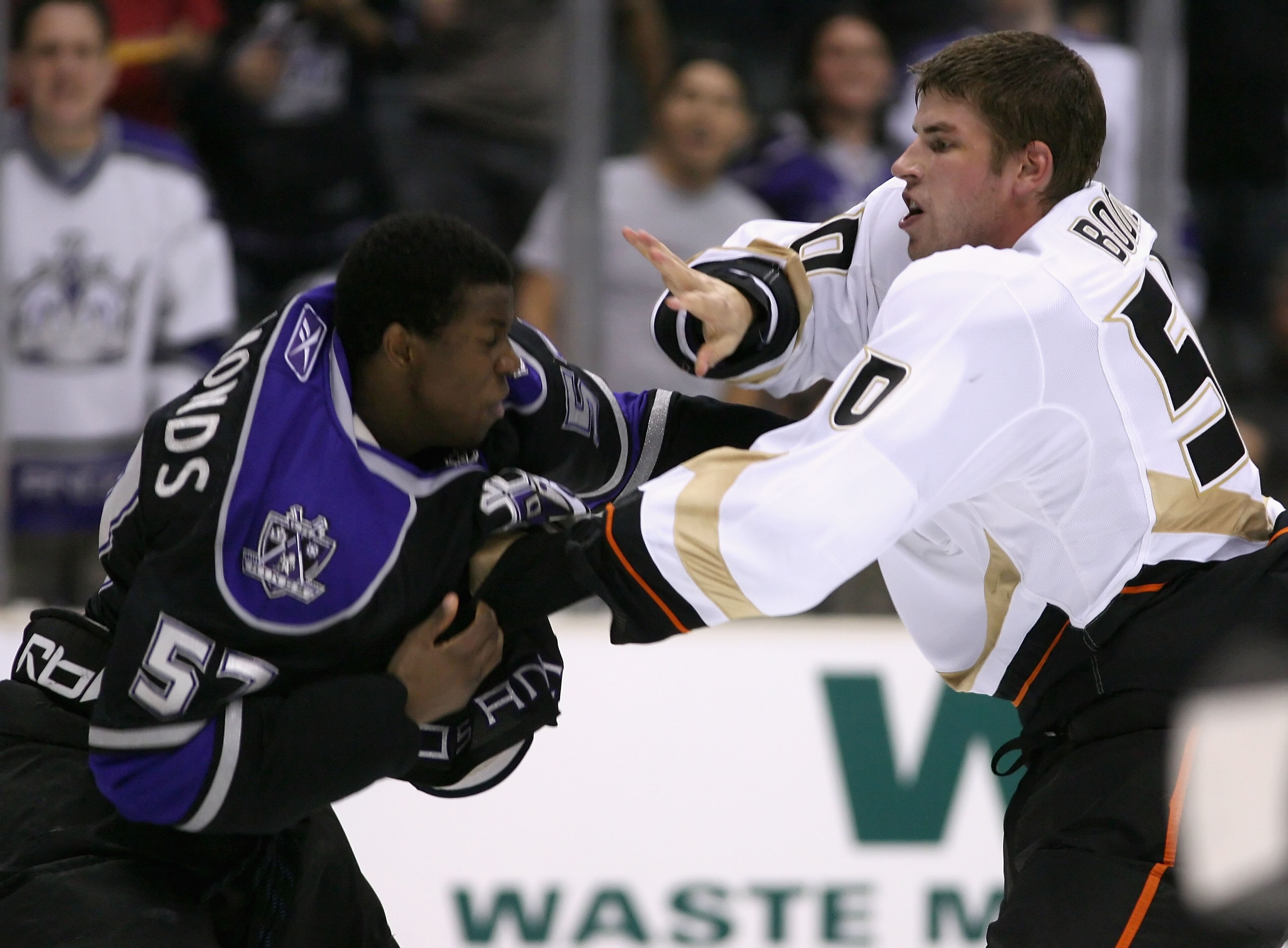 LOS ANGELES, CA - SEPTEMBER 30:  Troy Bodie #50 of the Anaheim Ducks fights with Wayne Simmonds #57 of the Los Angeles Kings during the preseason NHL game at Staples Center on September 30, 2008 in Los Angeles, California. The Ducks defeated the Kings 2-1