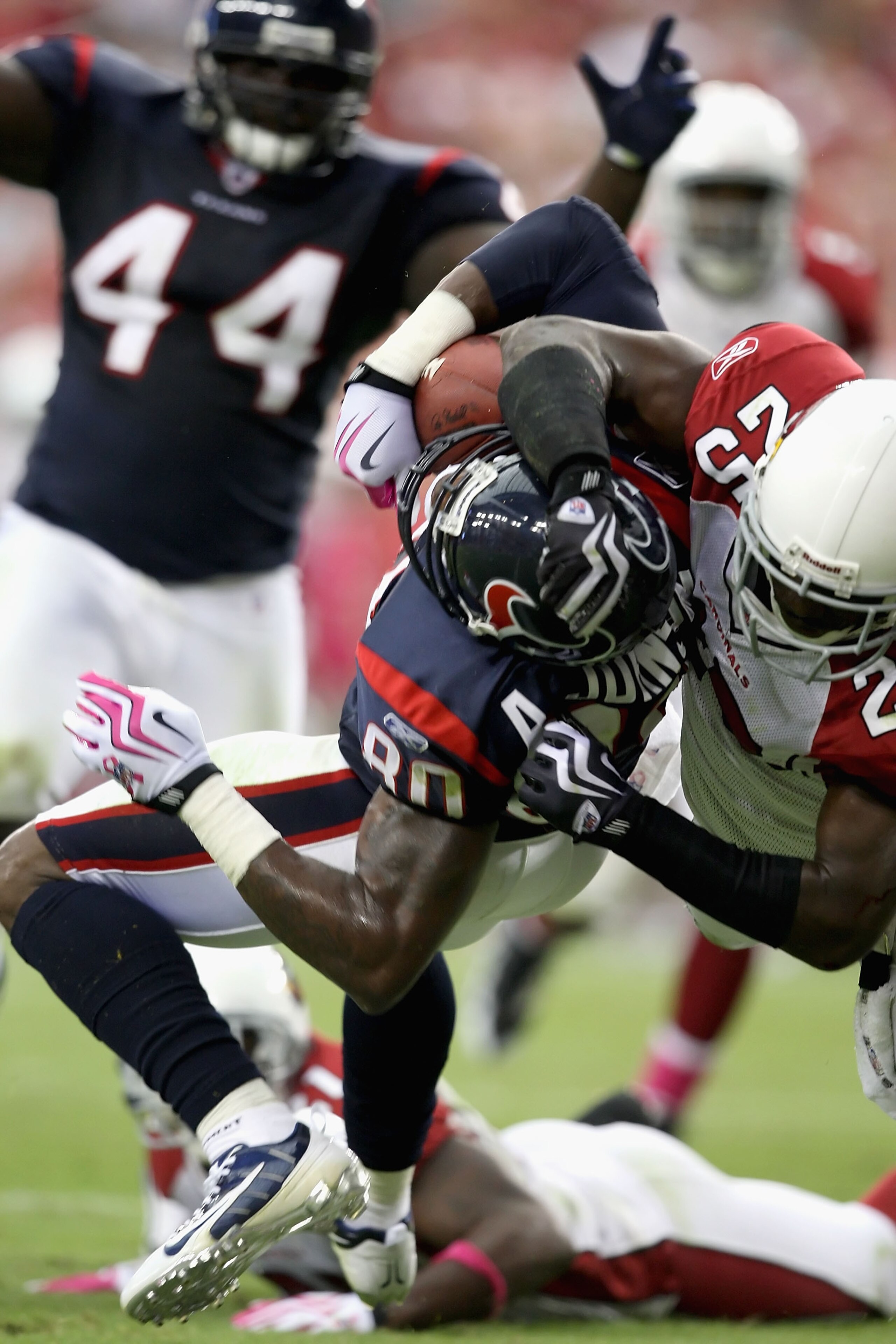 GLENDALE, AZ - OCTOBER 11: Wide receiver Andre Johnson #80 of the Houston Texans catches a 17 yard touchdown reception under pressure from Bryant McFadden #25 of the Arizona Cardinals during the fourth quarter of the NFL game at the Universtity of Phoenix