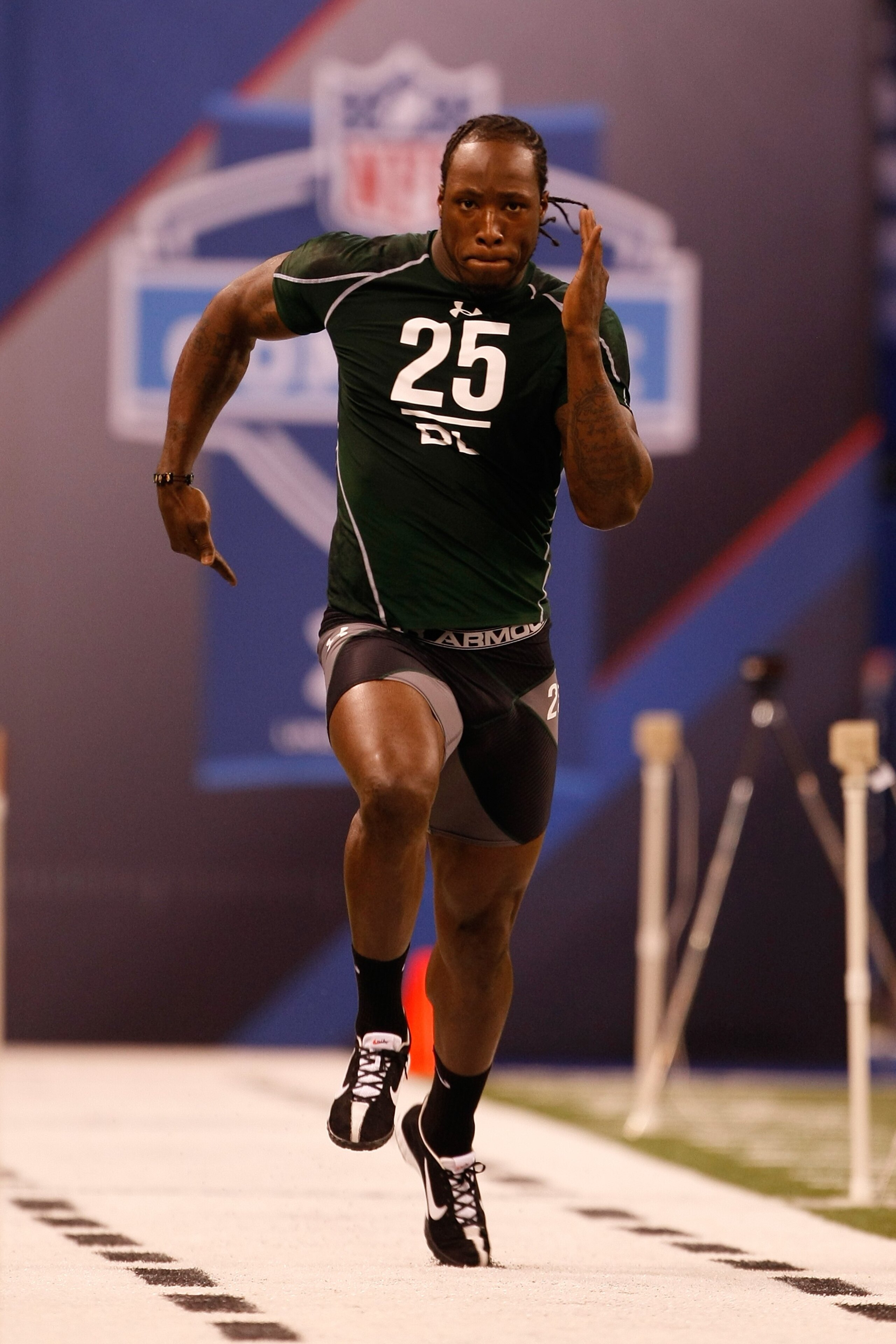 INDIANAPOLIS, IN - MARCH 1: Defensive lineman Sergio Kindle of Texas runs the 40 yard dash during the NFL Scouting Combine presented by Under Armour at Lucas Oil Stadium on March 1, 2010 in Indianapolis, Indiana. (Photo by Scott Boehm/Getty Images)