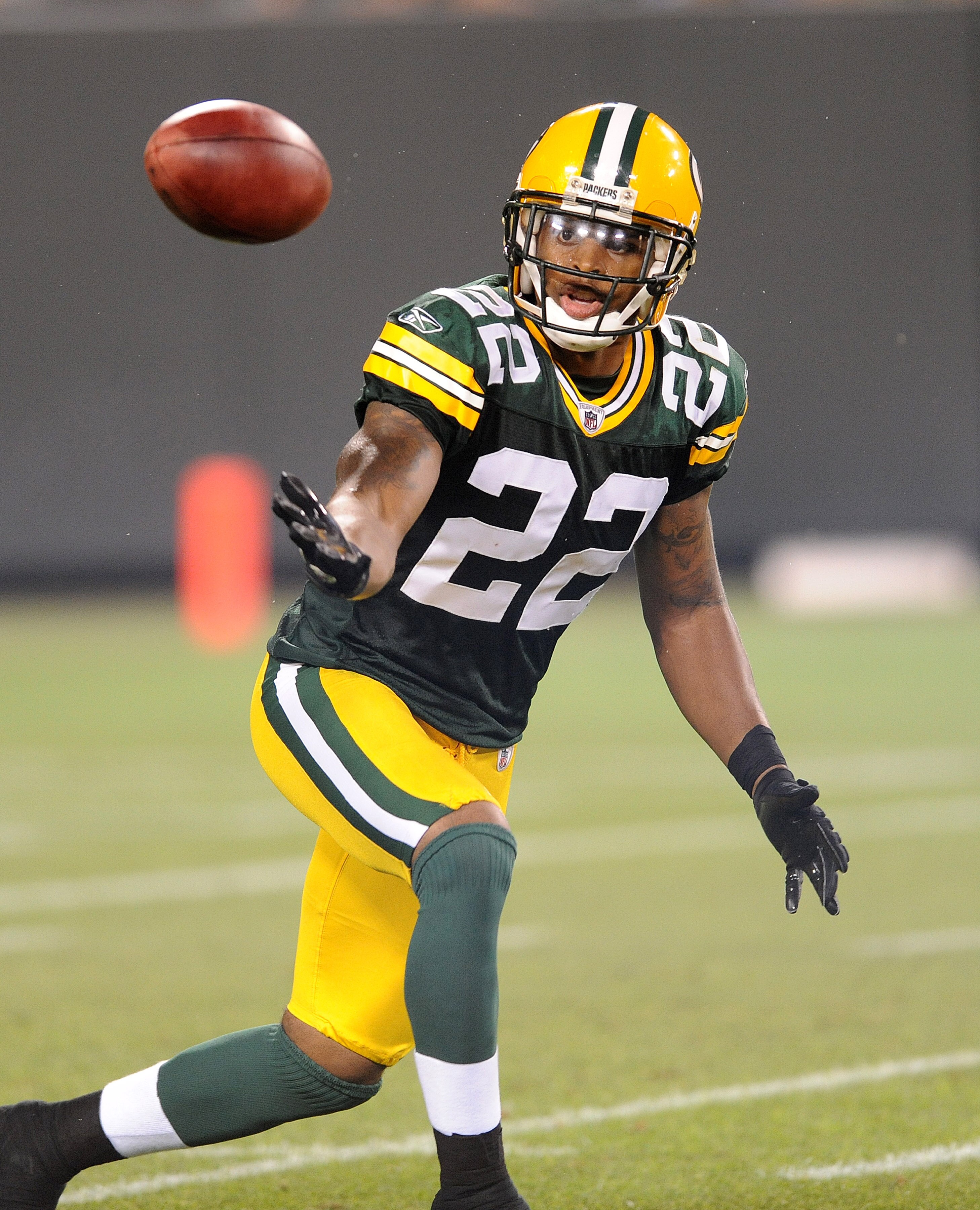 GREEN BAY, WI - AUGUST 14: Pat Lee #22 of the Green Bay Packers bobbles a kickoff during the NFL preseason game against the Cleveland Browns at Lambeau Field August 14, 2010 in Green Bay, Wisconsin. (Photo by Tom Dahlin/Getty Images)