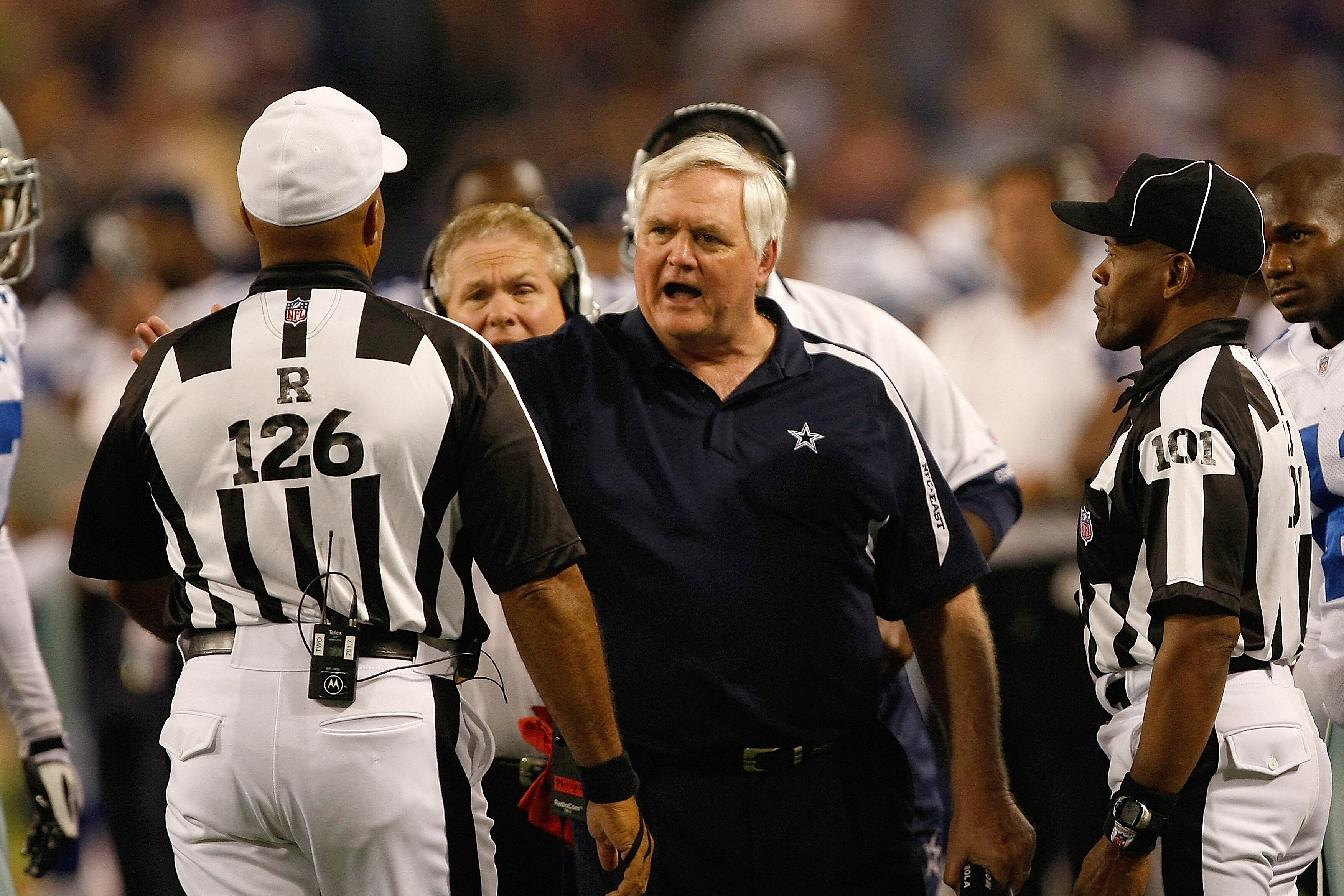 MINNEAPOLIS, MN - SEPTEMBER 4:  Head coach Wade Phillips of the Dallas Cowboys talks with referee Don Carey and line  judge Carl Johnson #101 during action against the Minnesota Vikings at Hubert H. Humphrey Metrodome on September 4, 2009 in Minneapolis,