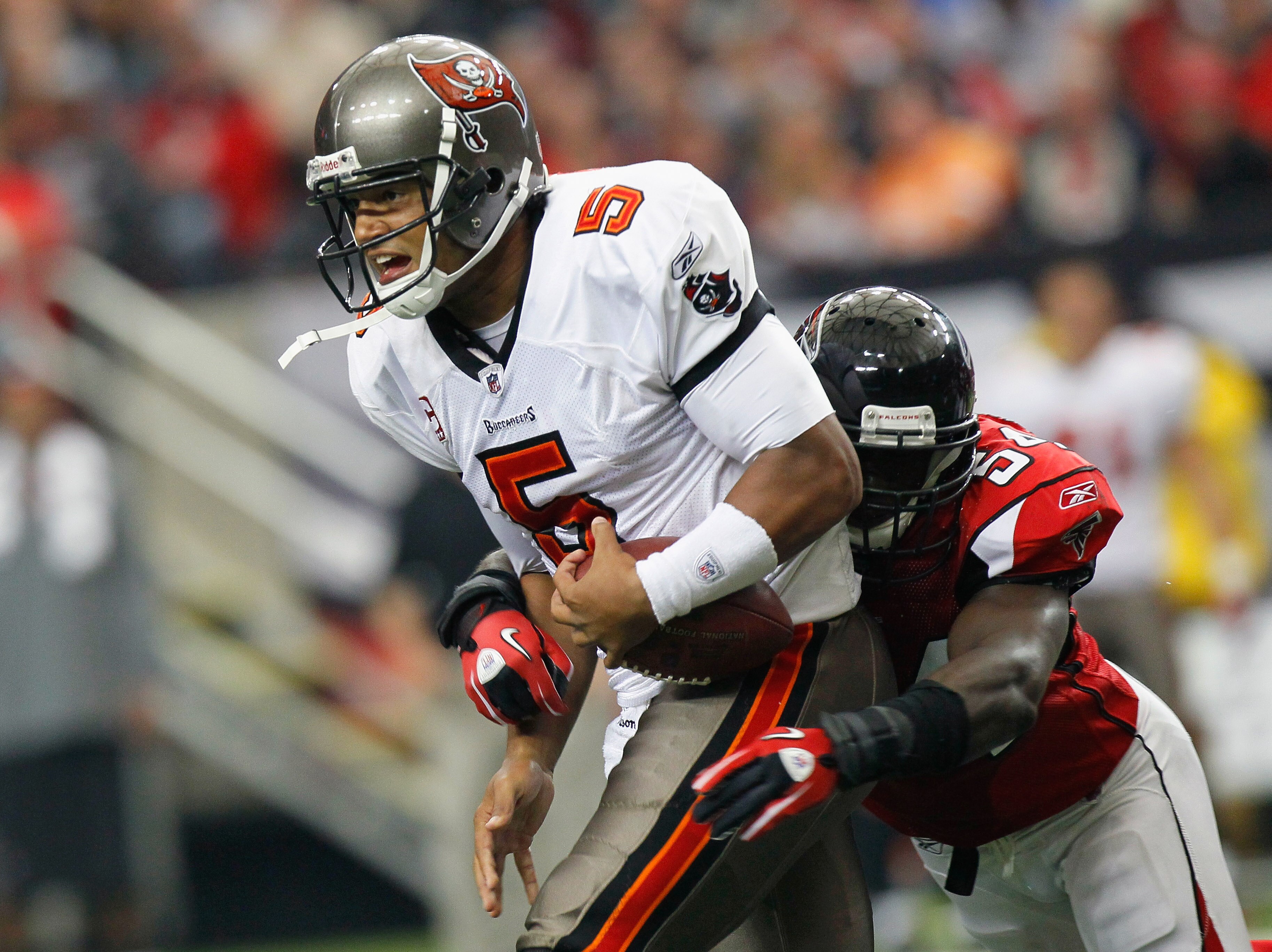 ATLANTA - NOVEMBER 07:  Quarterback Josh Freeman #5 of the Tampa Bay Buccaneers is tackledy by Stephen Nicholas #54 of the Atlanta Falcons at Georgia Dome on November 7, 2010 in Atlanta, Georgia.  (Photo by Kevin C. Cox/Getty Images)