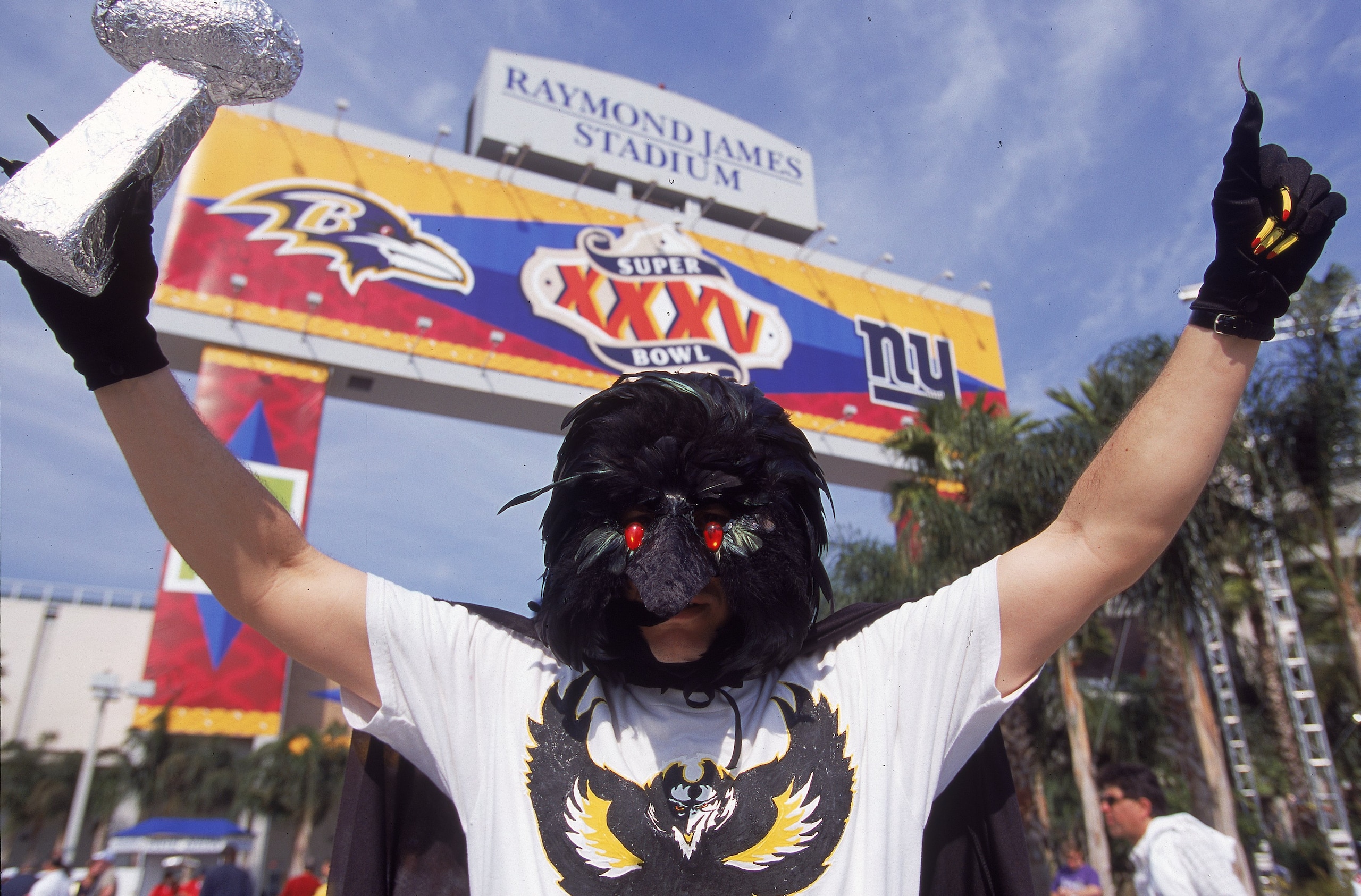 28 Jan 2001:  A fan of the Baltimore Ravens wears a raven mask as he holds up a fake trophy before the Super Bowl XXXV Game against the New York Giants at the Raymond James Stadium in Tampa, Florida. The Ravens defeated the Giants 34-7.Mandatory Credit: J