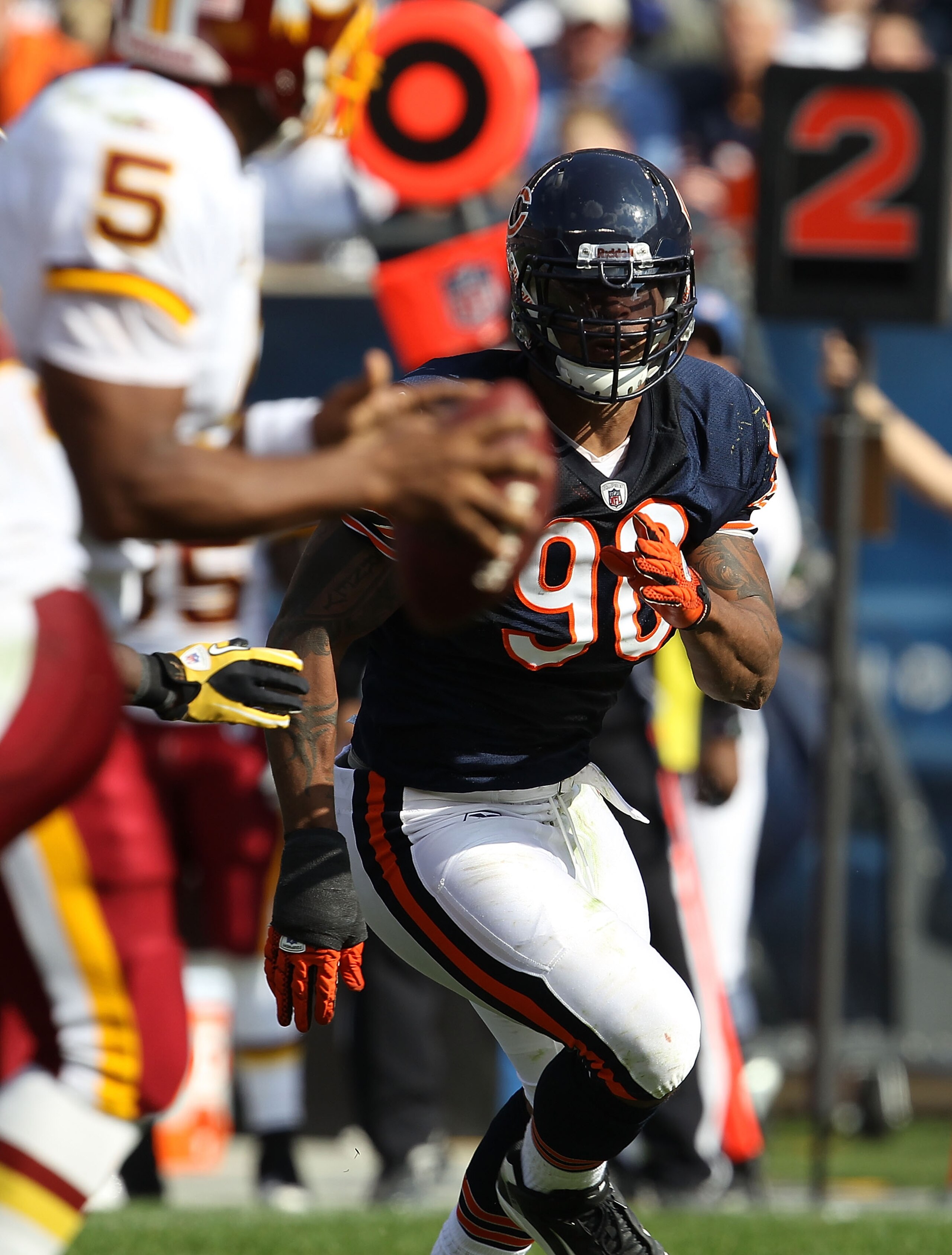 CHICAGO - OCTOBER 24: Julius Peppers #90 of the Chicago Bears rushes toward Dovonan McNabb #5 of the Washington Redskins at Soldier Field on October 24, 2010 in Chicago, Illinois. The Redskins defeated the Bears 17-14. (Photo by Jonathan Daniel/Getty Imag