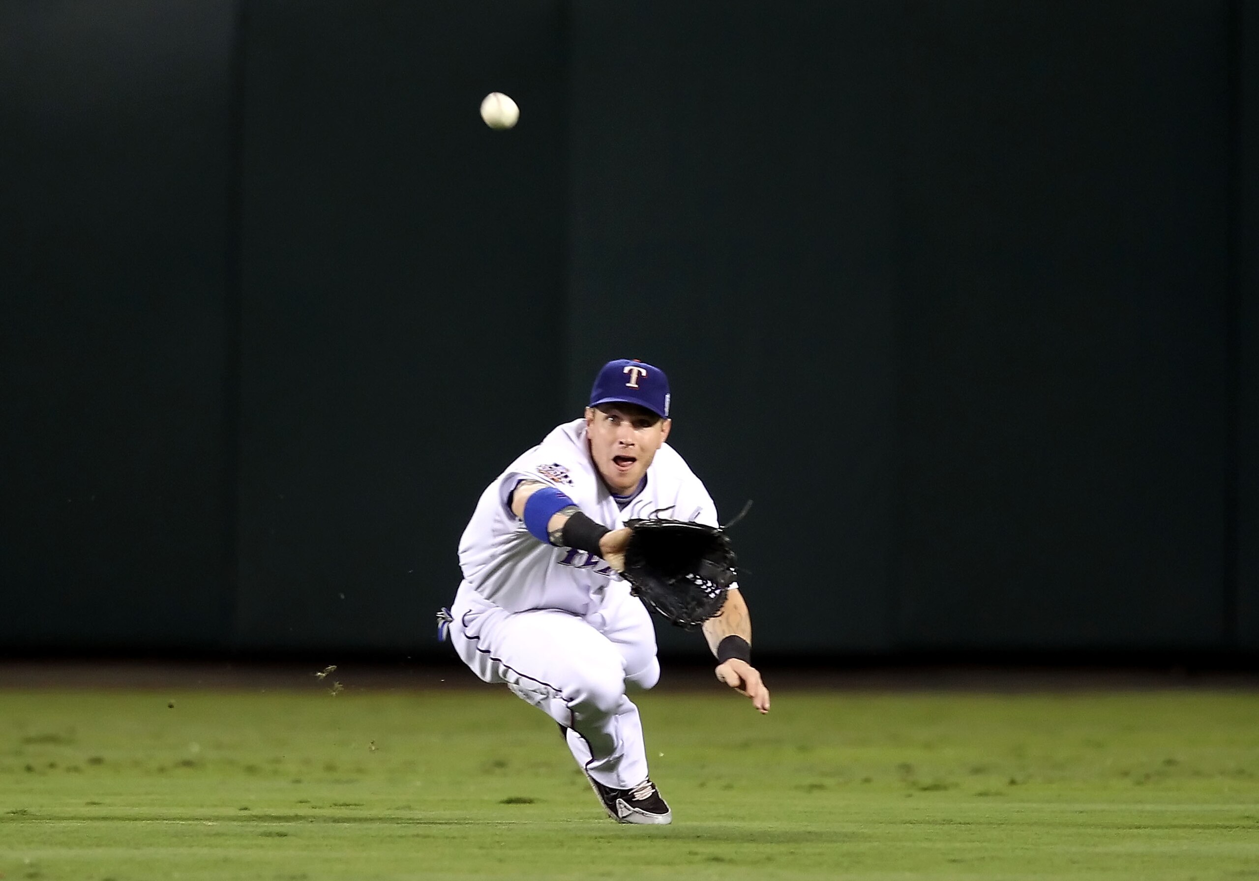 ARLINGTON, TX - OCTOBER 31: Josh Hamilton #32 of the Texas Rangers makes a diving catch in the second inning against the San Francisco Giants in Game Four of the 2010 MLB World Series at Rangers Ballpark in Arlington on October 31, 2010 in Arlington, Tex ARLINGTON, TX - OCTOBER 31: Josh Hamilton #32 of the Texas Rangers makes a diving catch in the second inning against the San Francisco Giants in Game Four of the 2010 MLB World Series at Rangers Ballpark in Arlington on October 31, 2010 in Arlington, Tex