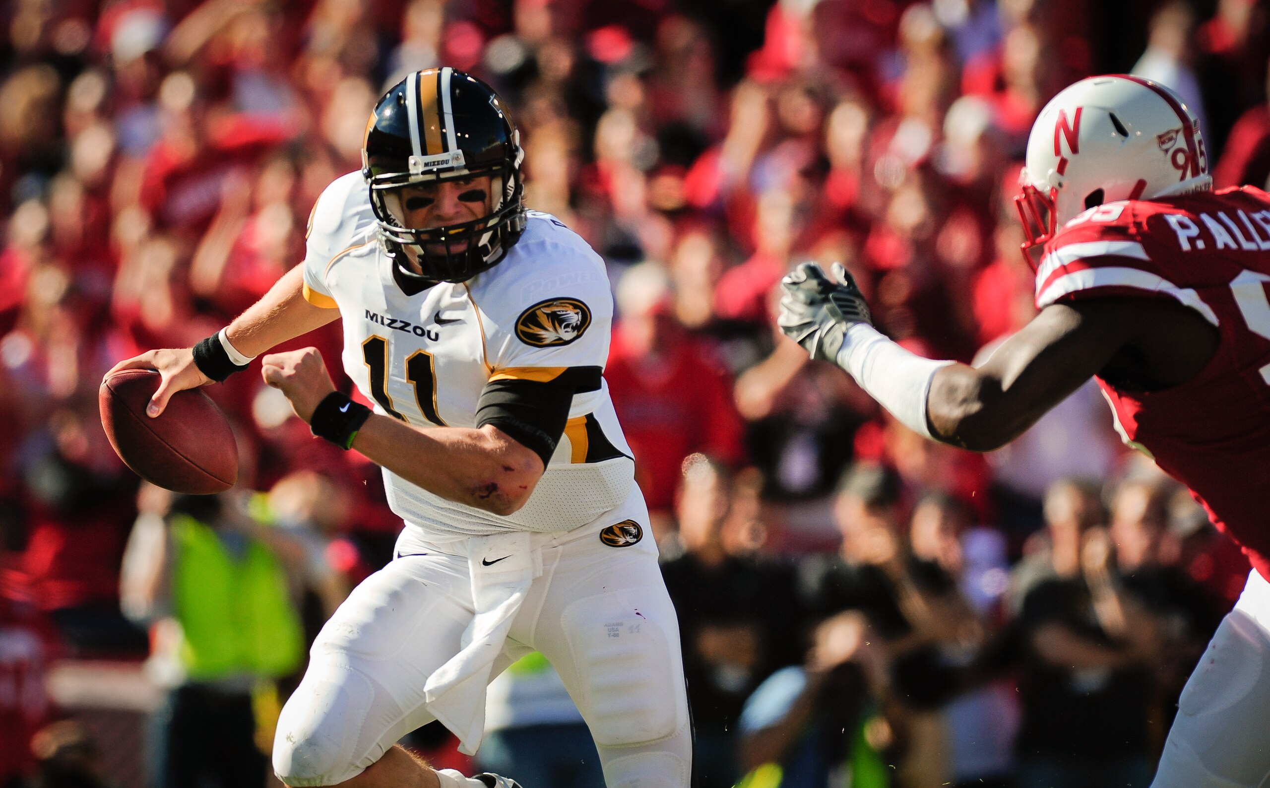 LINCOLN, NE - OCTOBER 30: Quarterback Blaine Gabbert #11 of the Missouri Tigers attempts to elude the Nebraska Cornhusker defense during first half action of their game at Memorial Stadium on October 30, 2010 in Lincoln, Nebraska. Nebraska Defeated Missou