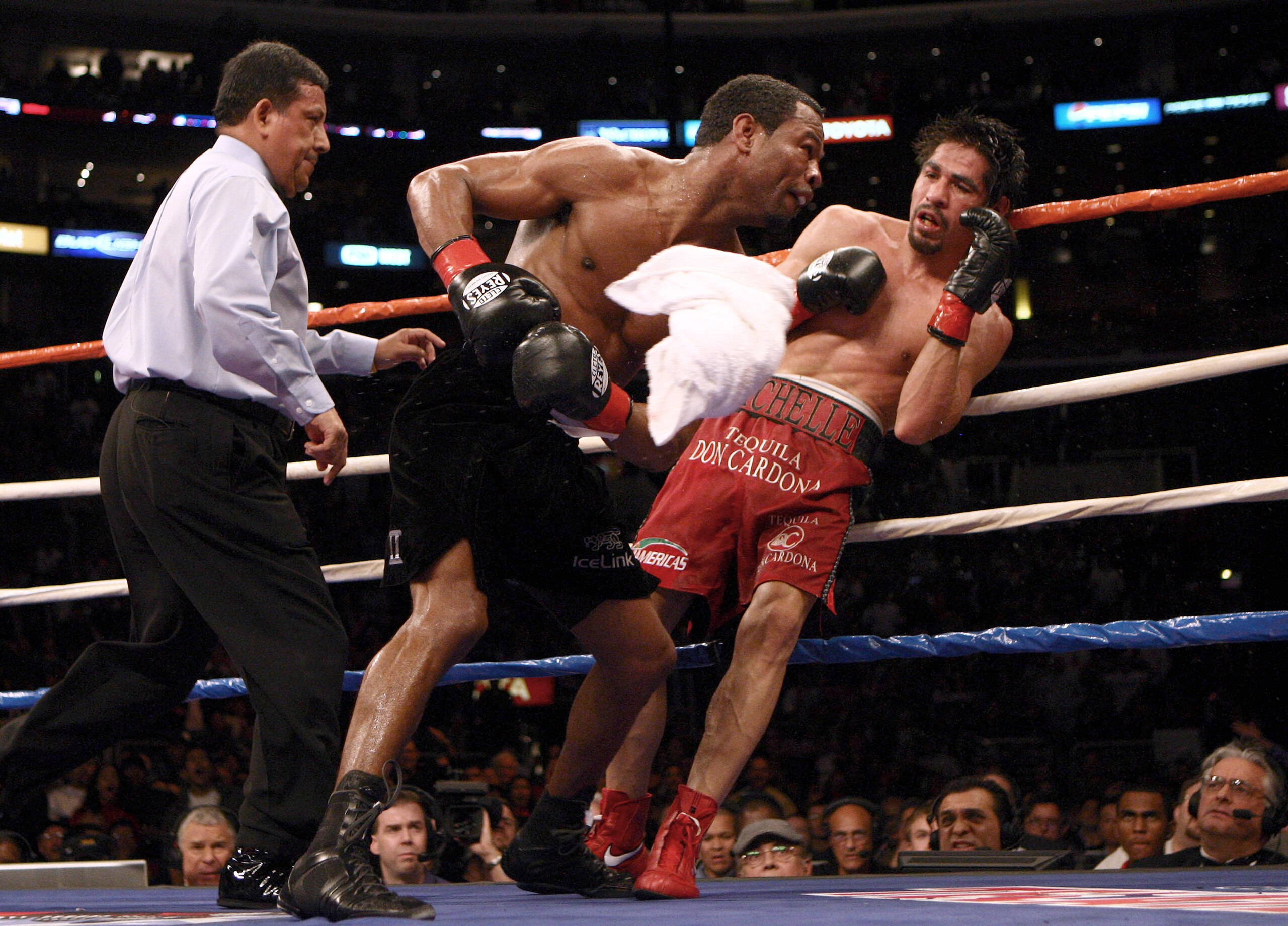 LOS ANGELES - JANUARY 24:   Shane Mosley lands a punch on Antonio Margarito as Margarito's corner throws in the towel en route to a TKO in the ninth round during their WBA welterweight title fight on January 24, 2009 at the Staples Center in Los Angeles,