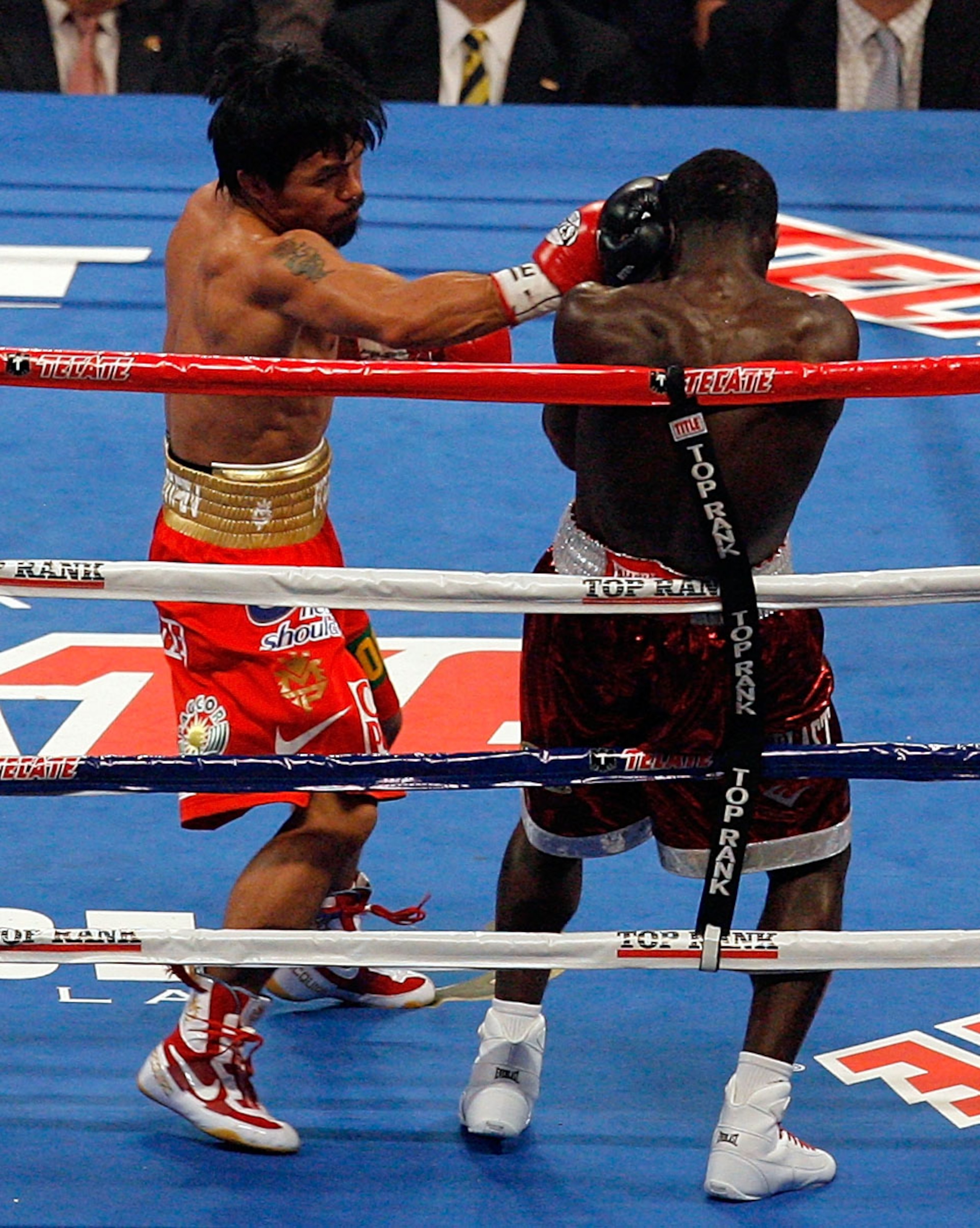ARLINGTON, TX - MARCH 13: (L-R) Manny Pacquiao of the Philippines throws a right to the head of Joshua Clottey of Ghana during the WBO welterweight title fight at Cowboys Stadium on March 13, 2010 in Arlington, Texas. (Photo by Tom Pennington/Getty Imag ARLINGTON, TX - MARCH 13: (L-R) Manny Pacquiao of the Philippines throws a right to the head of Joshua Clottey of Ghana during the WBO welterweight title fight at Cowboys Stadium on March 13, 2010 in Arlington, Texas. (Photo by Tom Pennington/Getty Imag