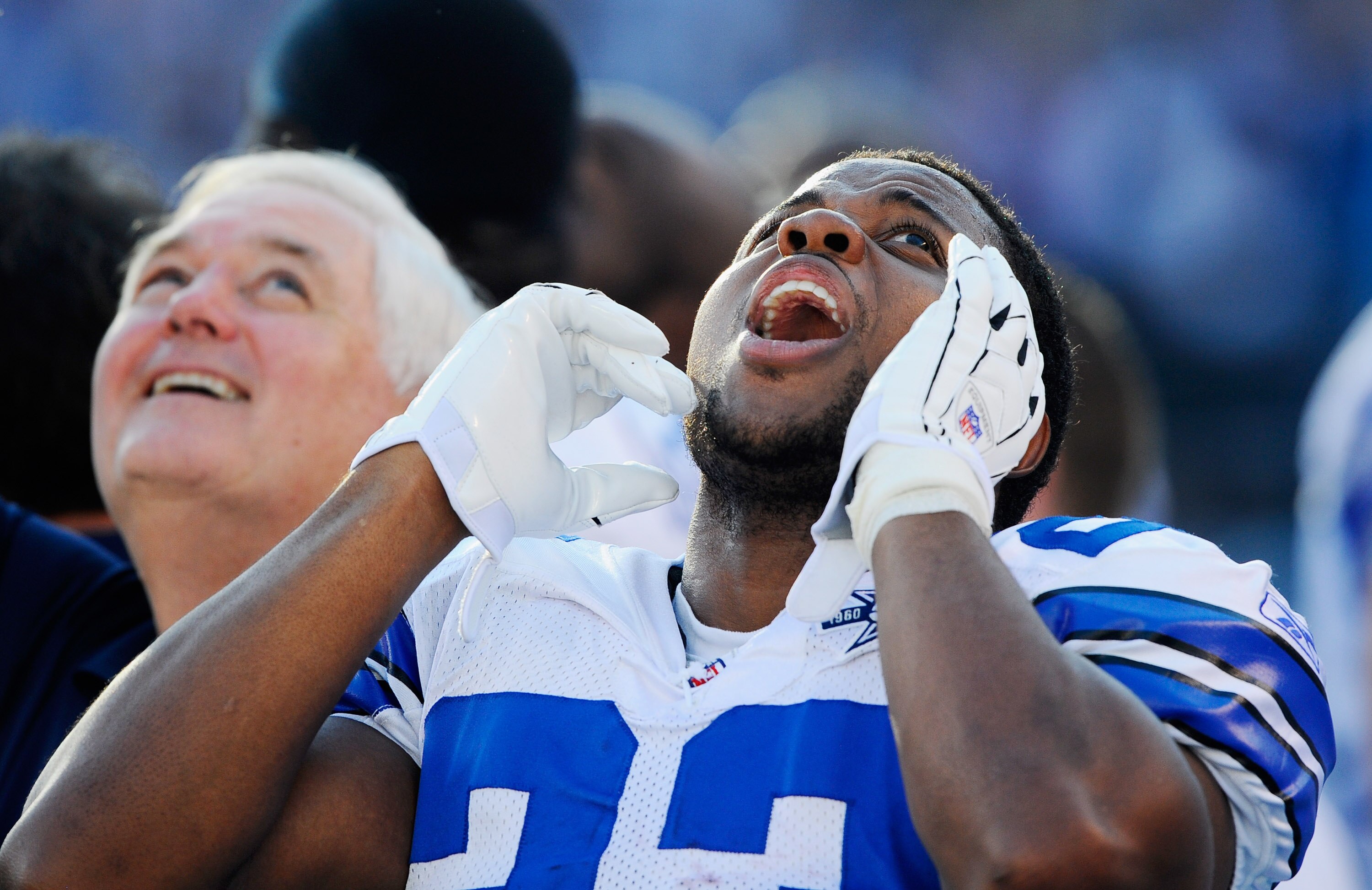 SAN DIEGO - AUGUST 21:  Running back Tashard Choice #23 and head coach Wade Phillips of the Dallas Cowboys reacts to a flyover by military jets during pre-game festivities of their pre-season NFL football game against San Diego Chargers at Qualcomm Stadiu