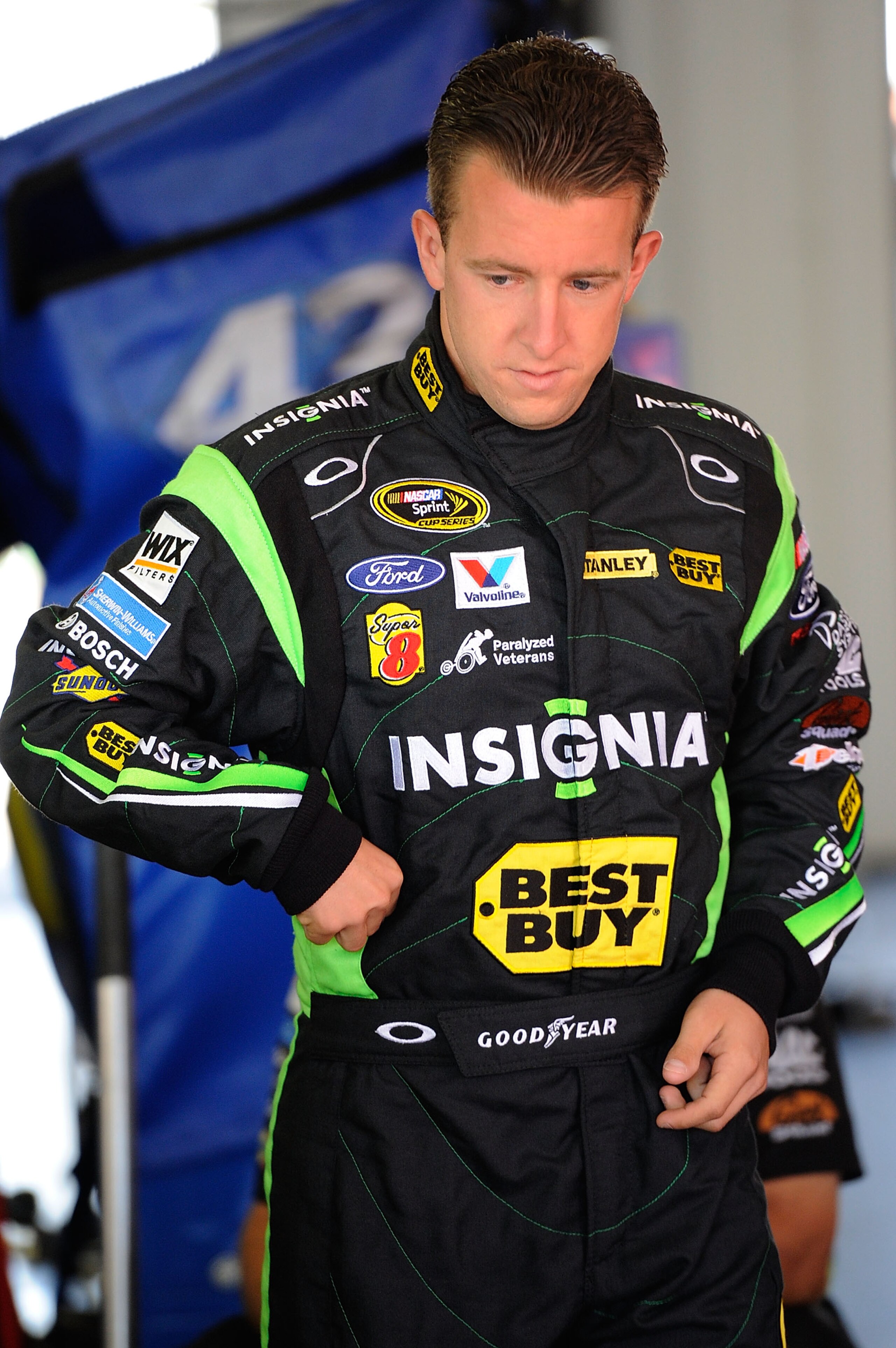 LONG POND, PA - JULY 31:  AJ Allmendinger, driver of the #43 Insignia HDTV Ford, waits in the garage during practice for the NASCAR Sprint Cup Series Sunoco Red Cross Pennsylvania 500 at Pocono Raceway on July 31, 2010 in Long Pond, Pennsylvania.  (Photo