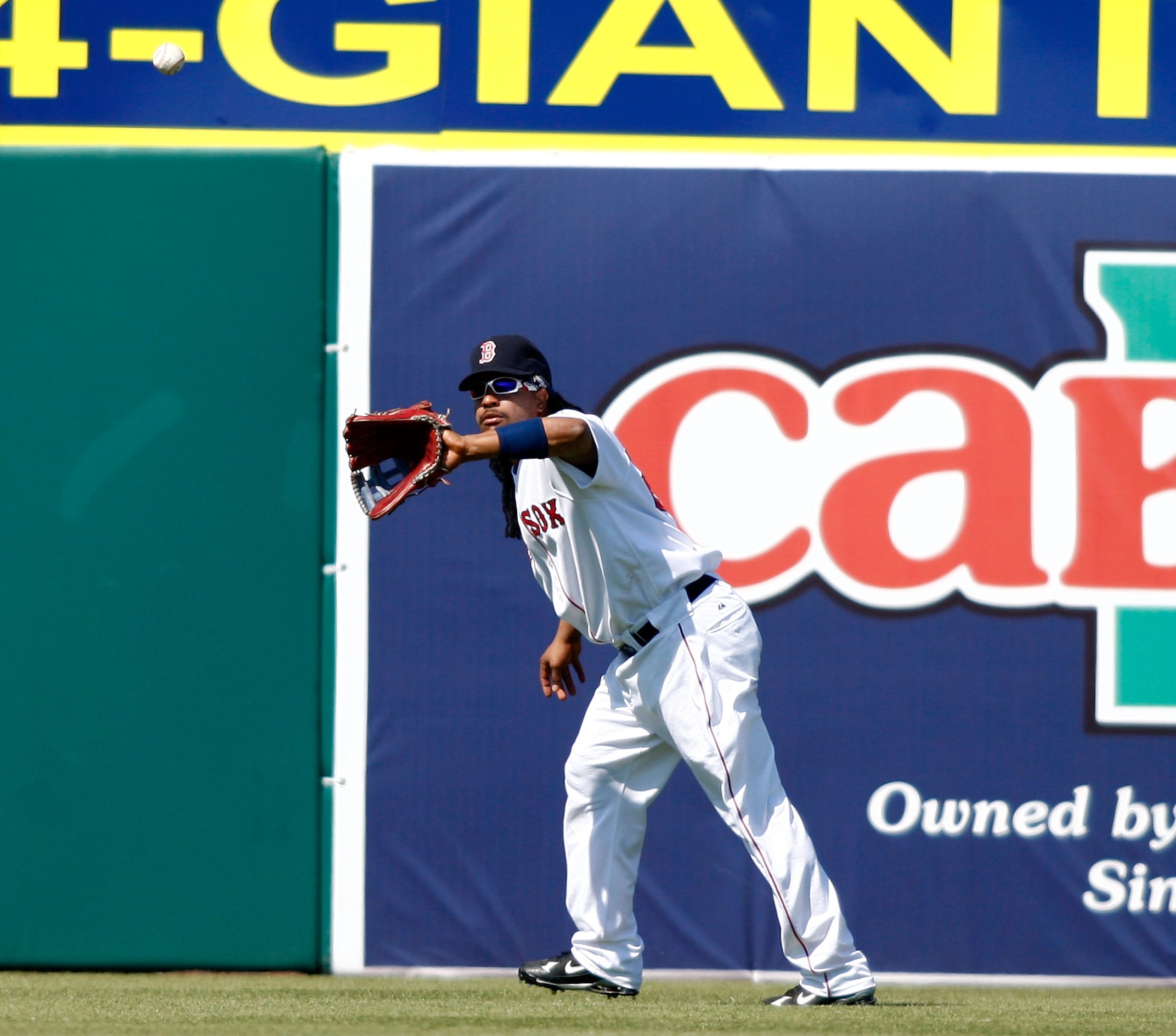 FORT MYERS, FL - MARCH 02:  Outfielder Manny Ramirez #24 of the Boston Red Sox makes a play on this ball in left field against the Minnesota Twins during the game on March 2, 2008 at City of Palms Park in Ft. Myers, Florida.  (Photo by J. Meric/Getty Imag