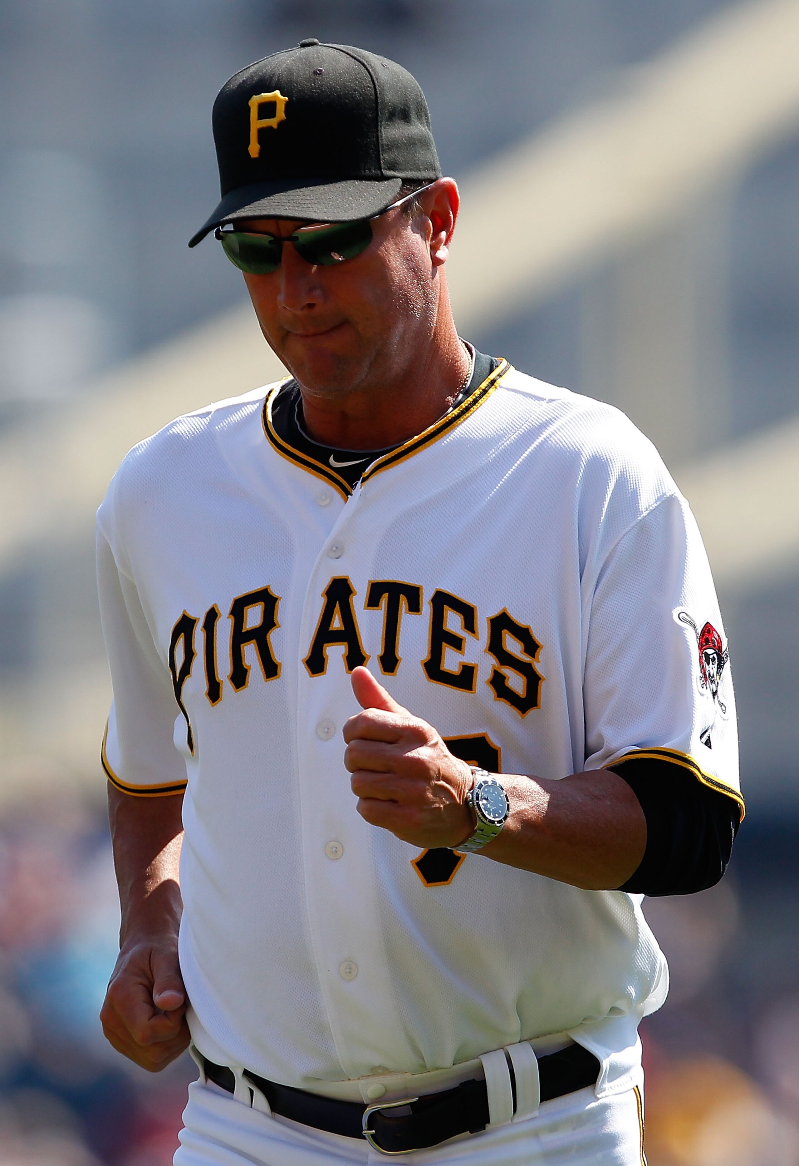 PITTSBURGH - SEPTEMBER 23:  Manager John Russell #7 of the Pittsburgh Pirates jobs back to the dugout after relieving Brian Burres #71 during the game against the St Louis Cardinals on September 23, 2010 at PNC Park in Pittsburgh, Pennsylvania.  (Photo by