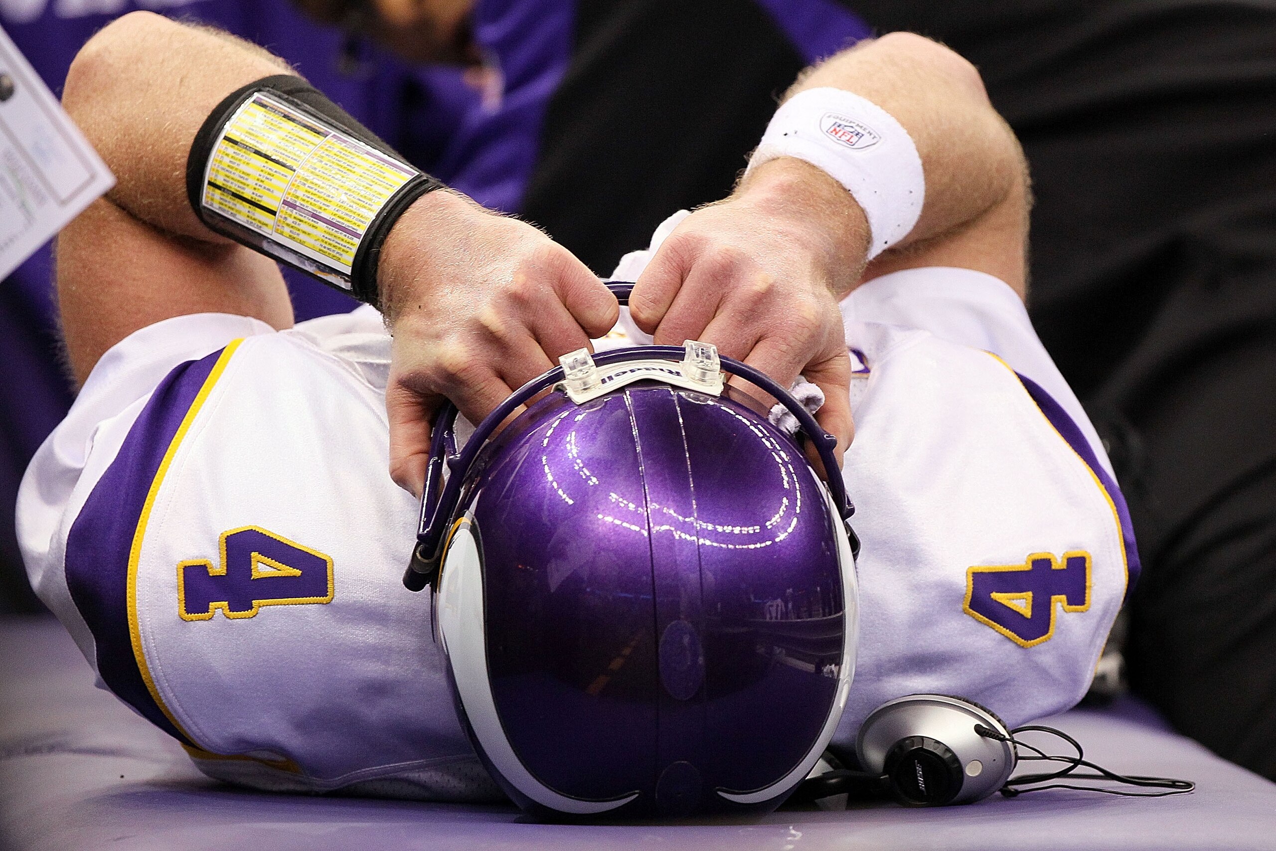 NEW ORLEANS - JANUARY 24:  Brett Favre #4 of  the Minnesota Vikings is checked on by medical staff after getting injured on a play against the New Orleans Saints during the NFC Championship Game at the Louisiana Superdome on January 24, 2010 in New Orlean