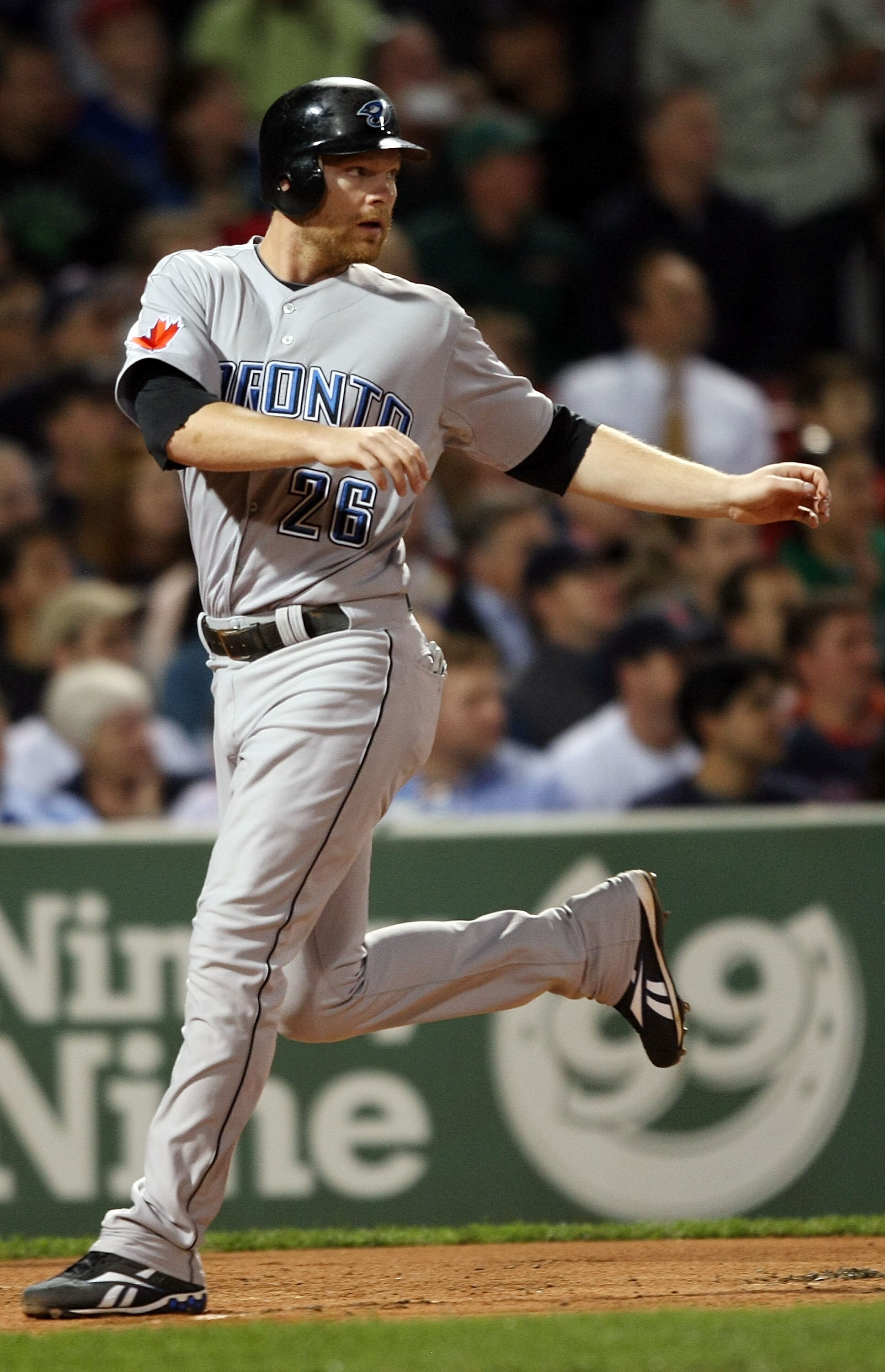BOSTON - SEPTEMBER 28:  Adam Lind #26 of the Toronto Blue Jays scores a run in the first inning against the Boston Red Sox on September 28, 2009 at Fenway Park in Boston, Massachusetts.  (Photo by Elsa/Getty Images)