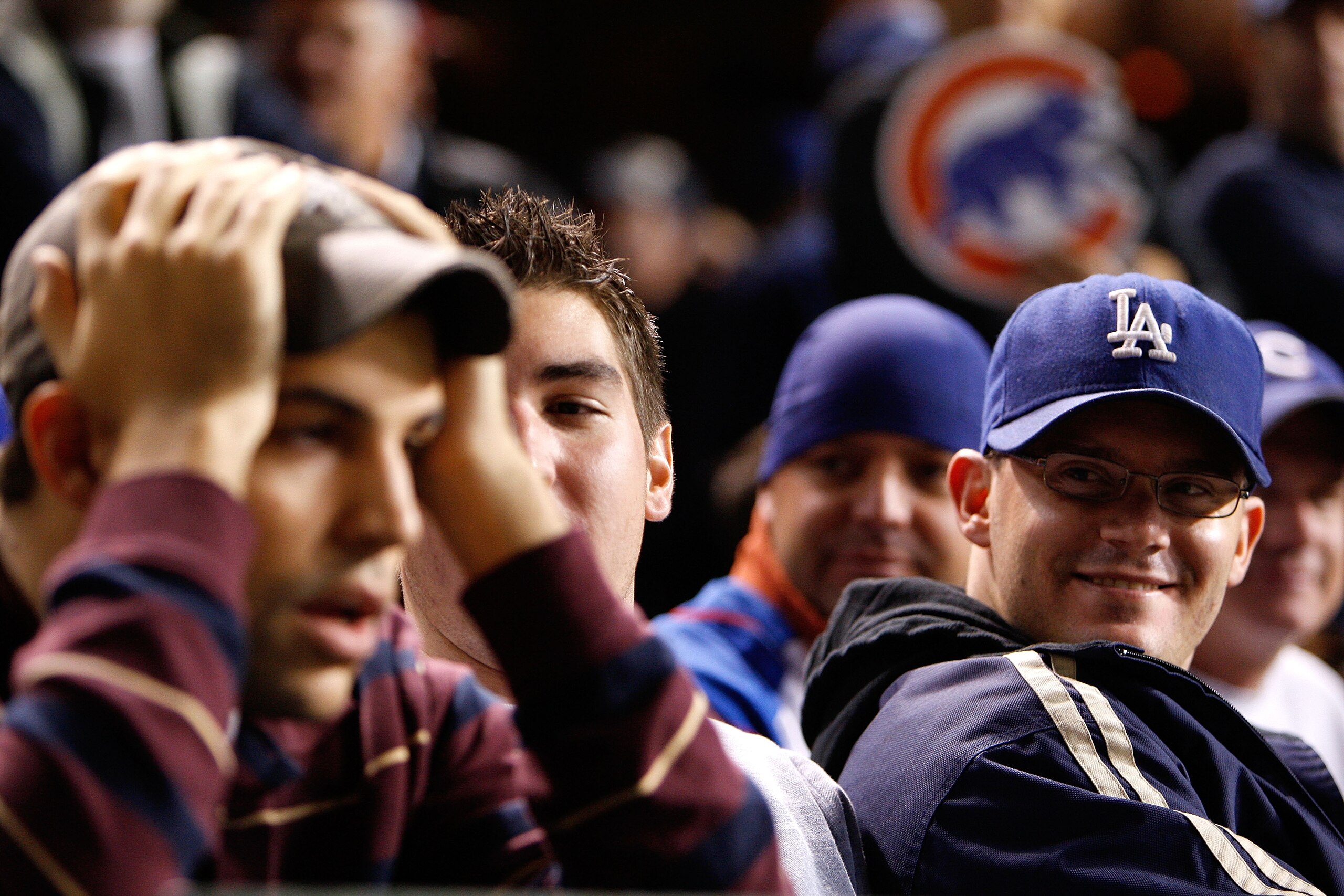 CHICAGO - OCTOBER 02:  Brian Engler (R), a fan of the Los Angeles Dodgers looks towars a dejected Michael Piper (L), a fan of the Chicago Cubs in Game Two of the NLDS during the 2008 MLB Playoffs at Wrigley Field on October 2, 2008 in Chicago, Illinois. T