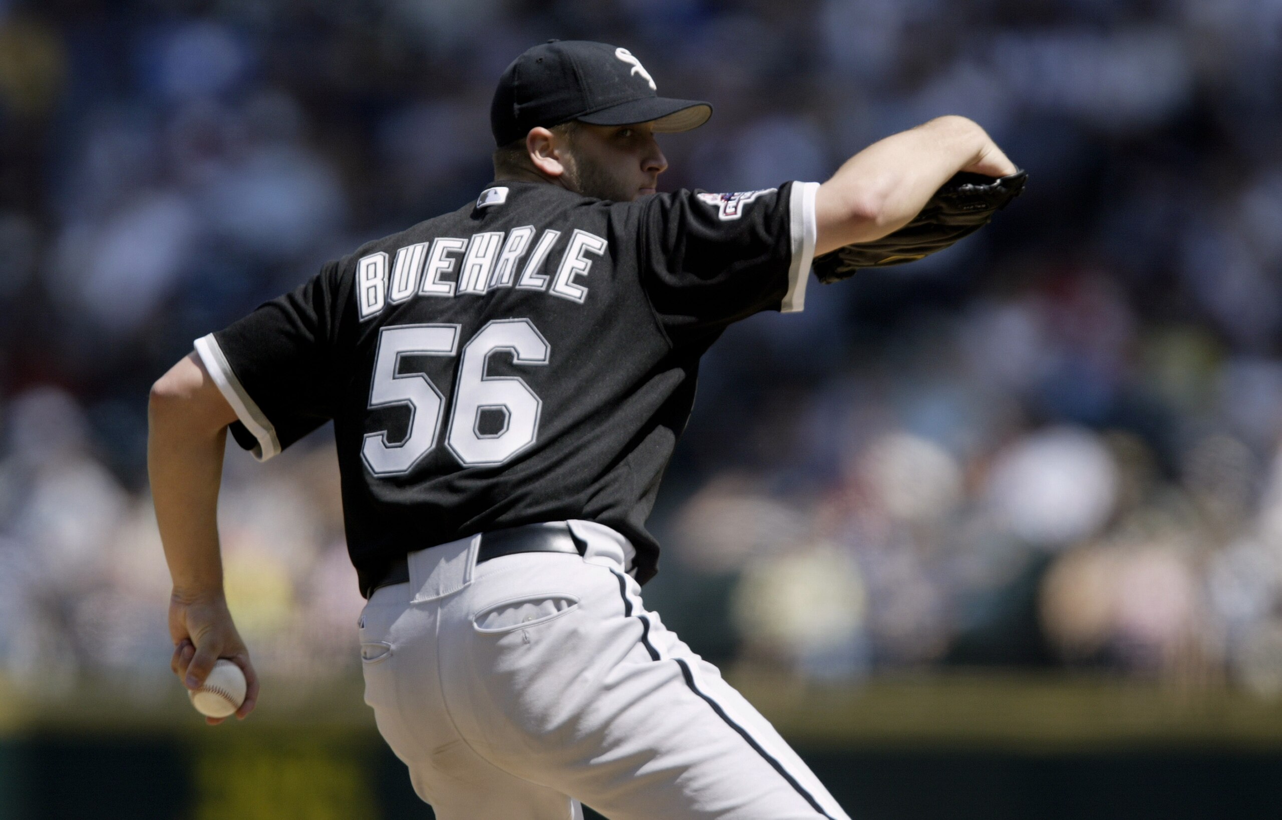 SEATTLE - AUGUST 3:  Starting Pitcher Mark Beuhrle #46 of the Chicago White Sox delivers against the Seattle Mariners during the MLB game at Safeco Field on August 3, 2003 in Seattle, Washington.  The Mariners won 8-2.  (Photo by Otto Greule Jr/Getty Imag